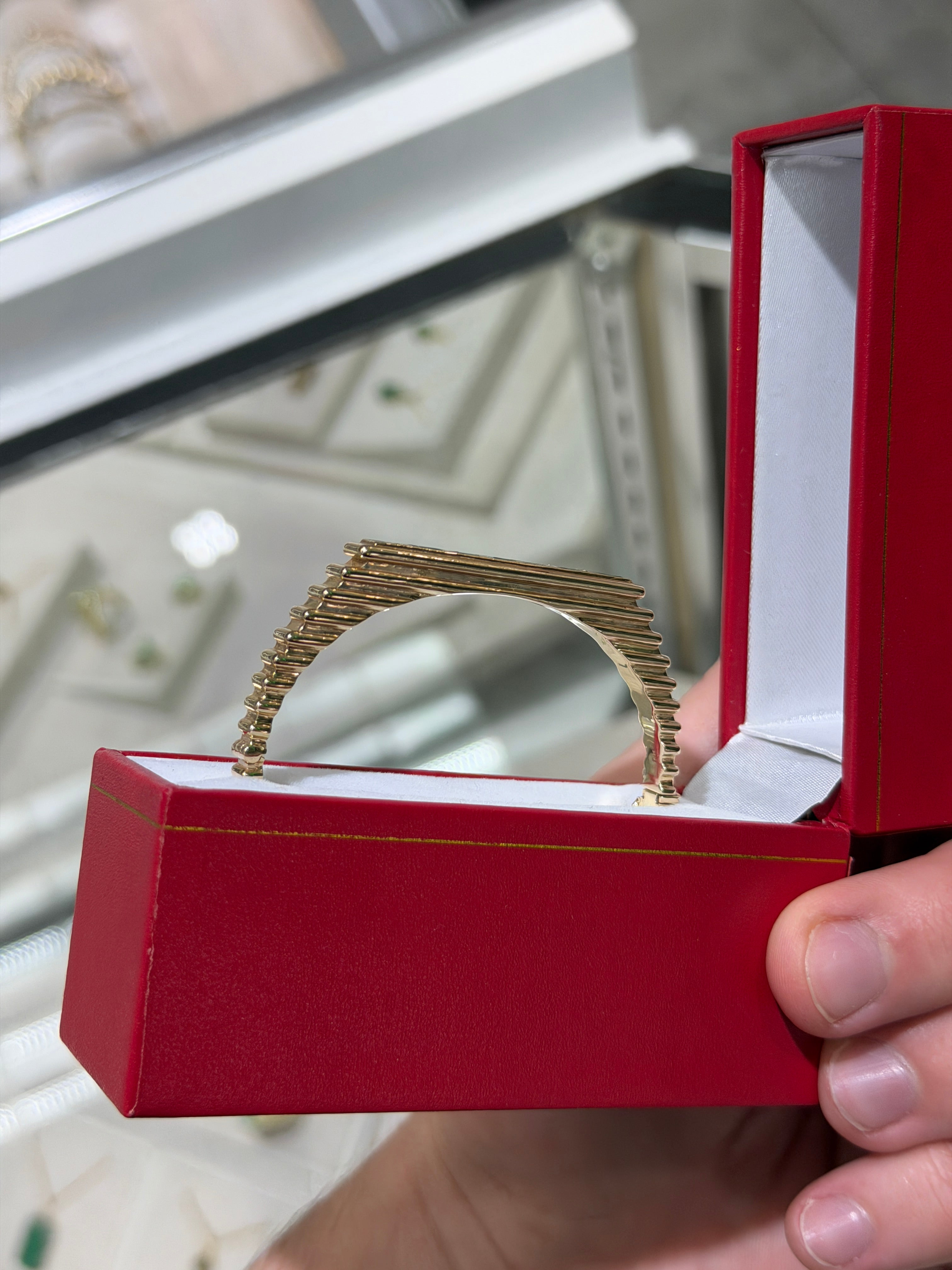 14K gold princess cut emerald bangle bracelet with bezel setting and ribbed design, featuring 1.64 carats from JR Colombian Emeralds.