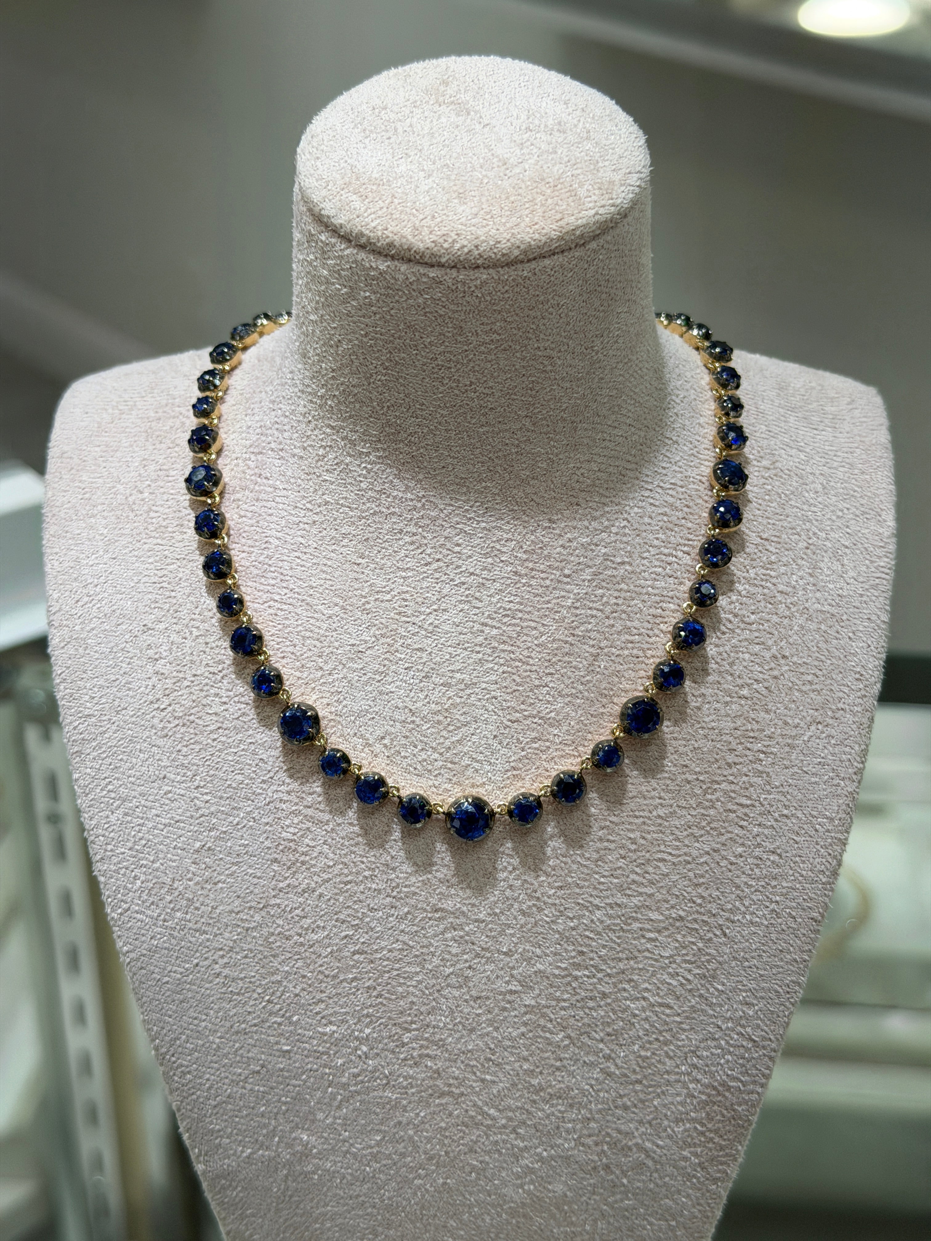 14K gold necklace with deep blue Kyanite round cut stones and diamond clasp, 17-inch length, from JR Colombian Emeralds.