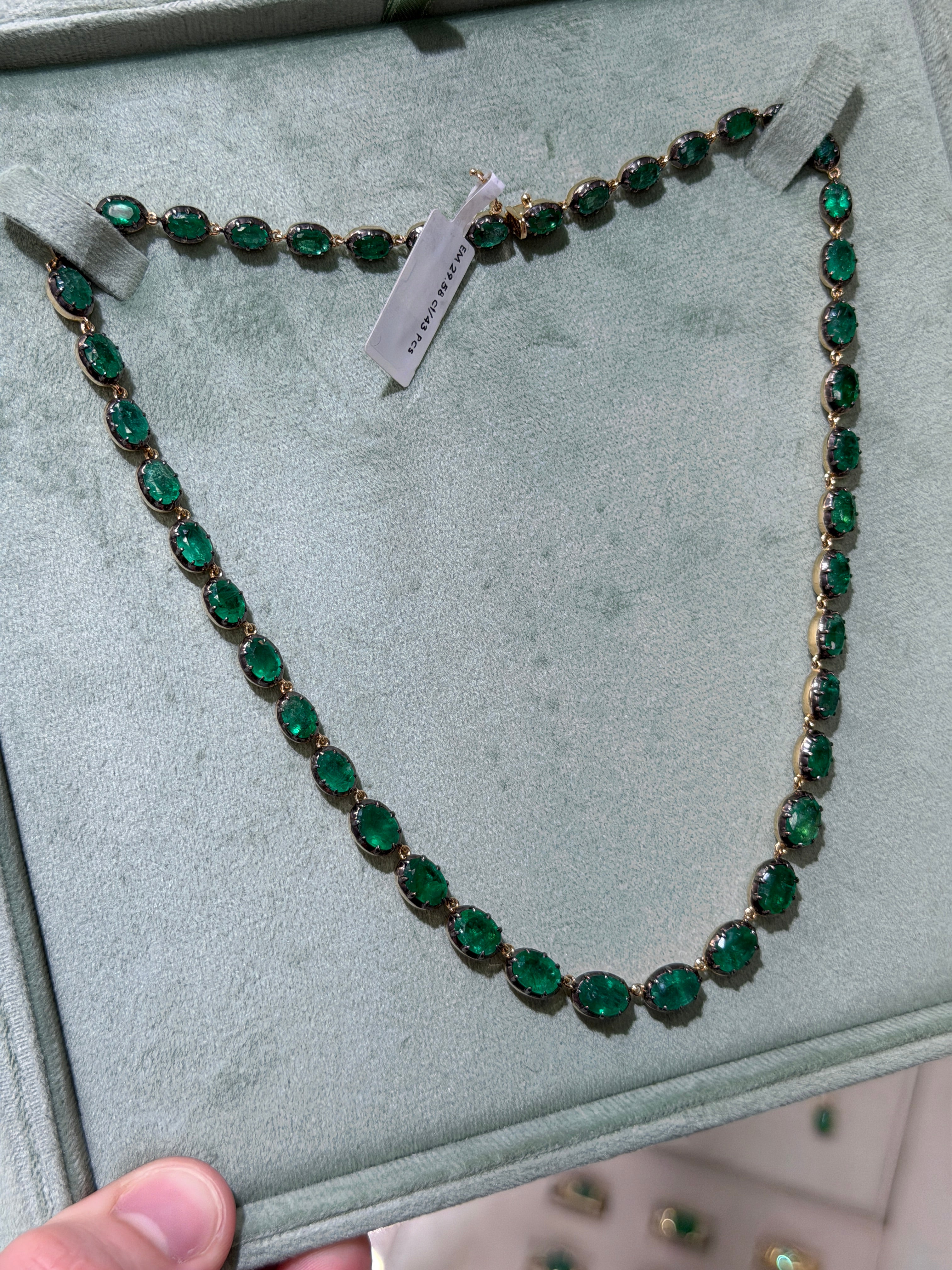 14K gold tennis necklace with oval cut black rhodium buttons, 29.58tcw from JR Colombian Emeralds, 17-inch length.