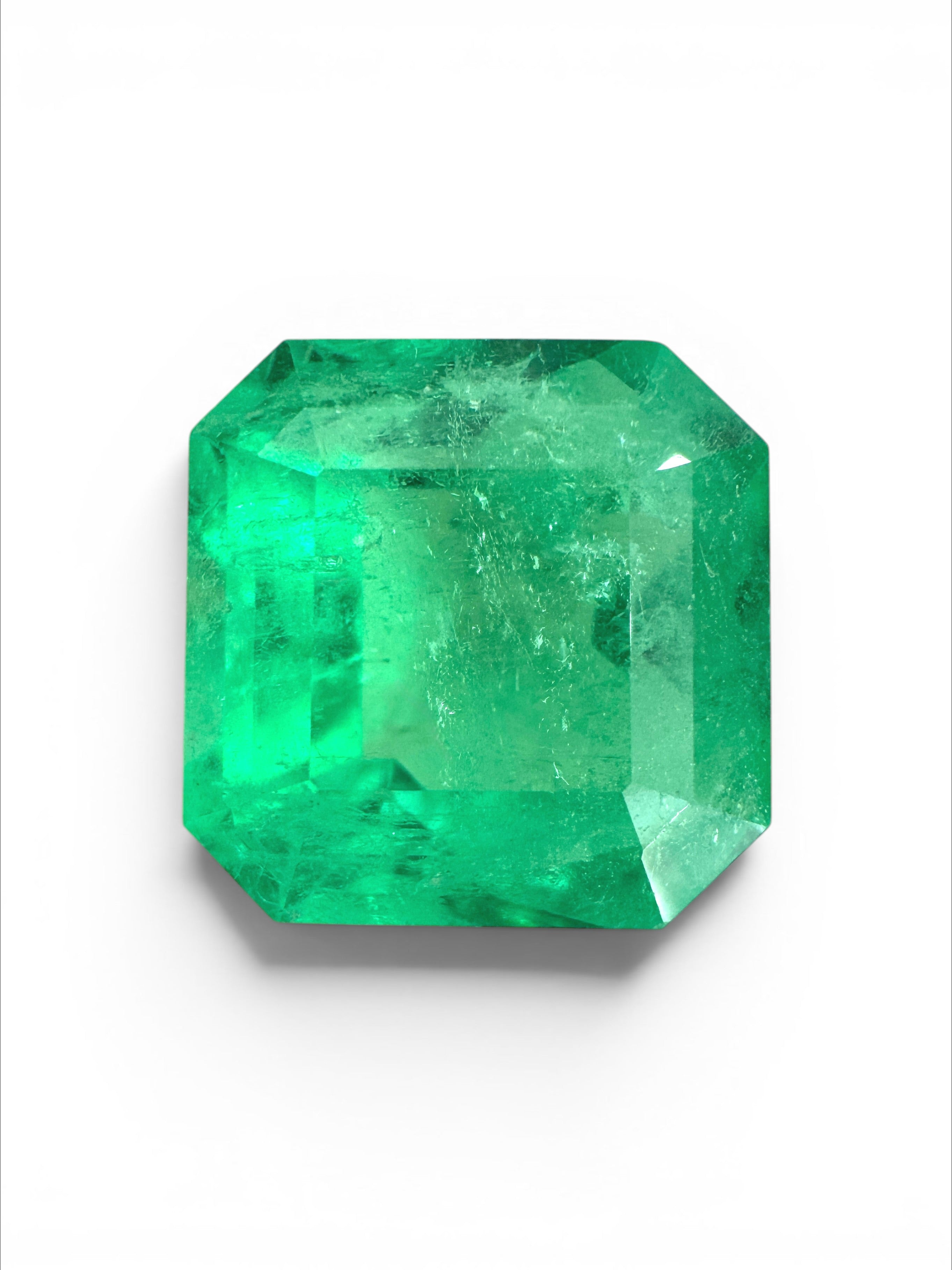 Yellowish green 4.88 carat Colombian emerald Asscher cut with clipped corners, from JR Colombian Emeralds.