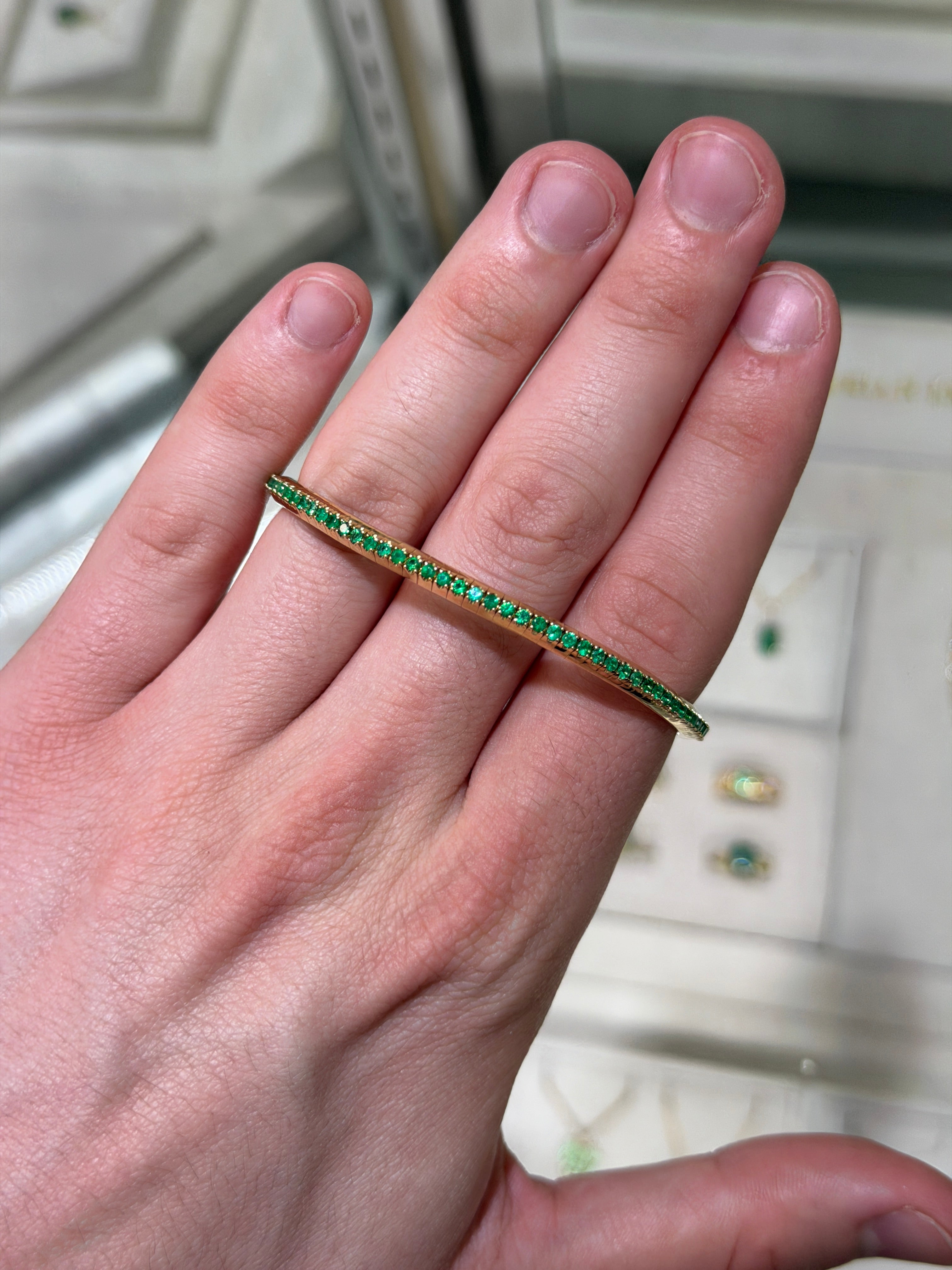 14K gold tennis bracelet with 3.30tcw natural round emeralds, stretchy design, by JR Colombian Emeralds.