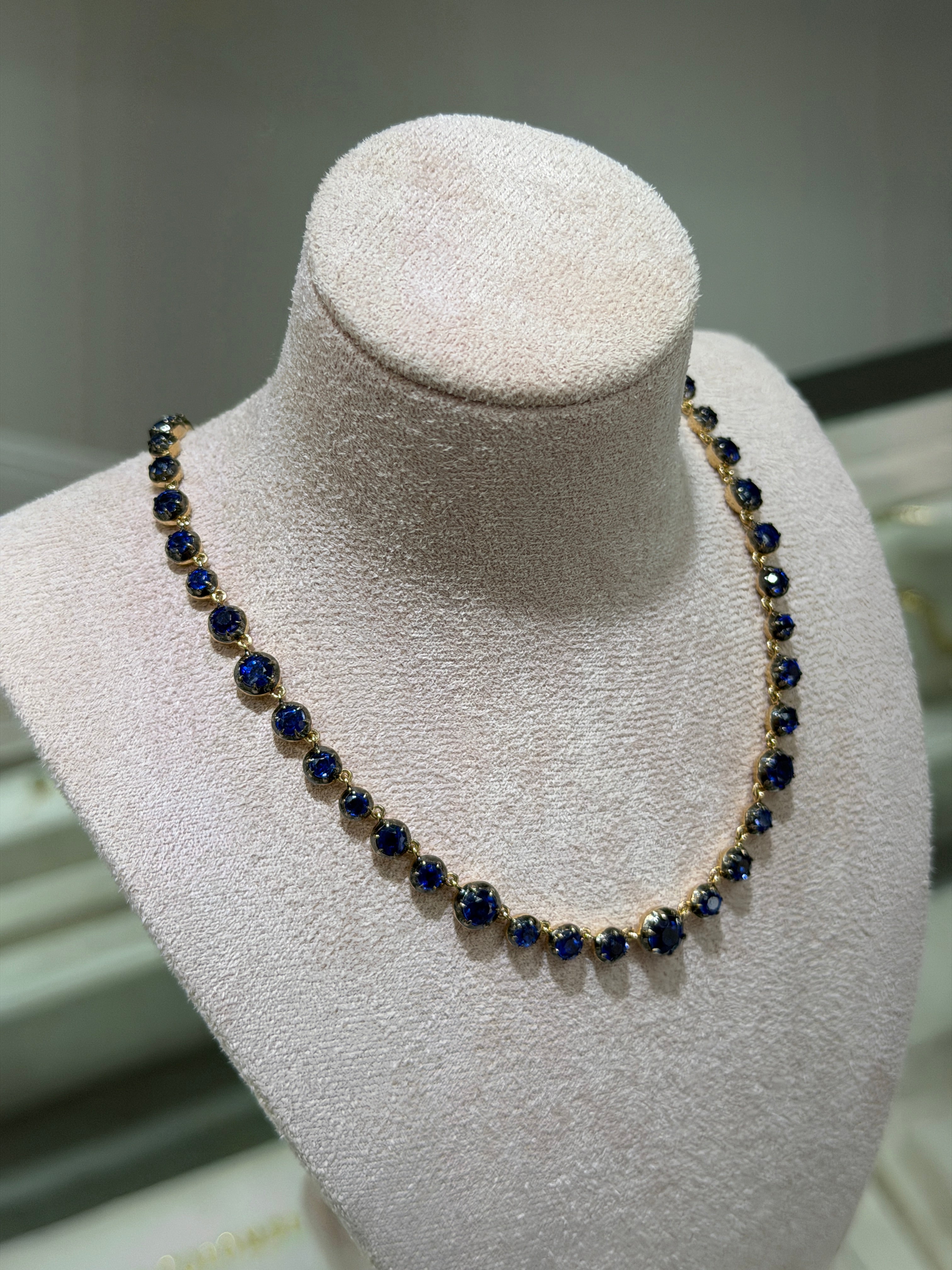 14K gold necklace with deep blue Kyanite round cut stones and diamond clasp, 17-inch length, from JR Colombian Emeralds.