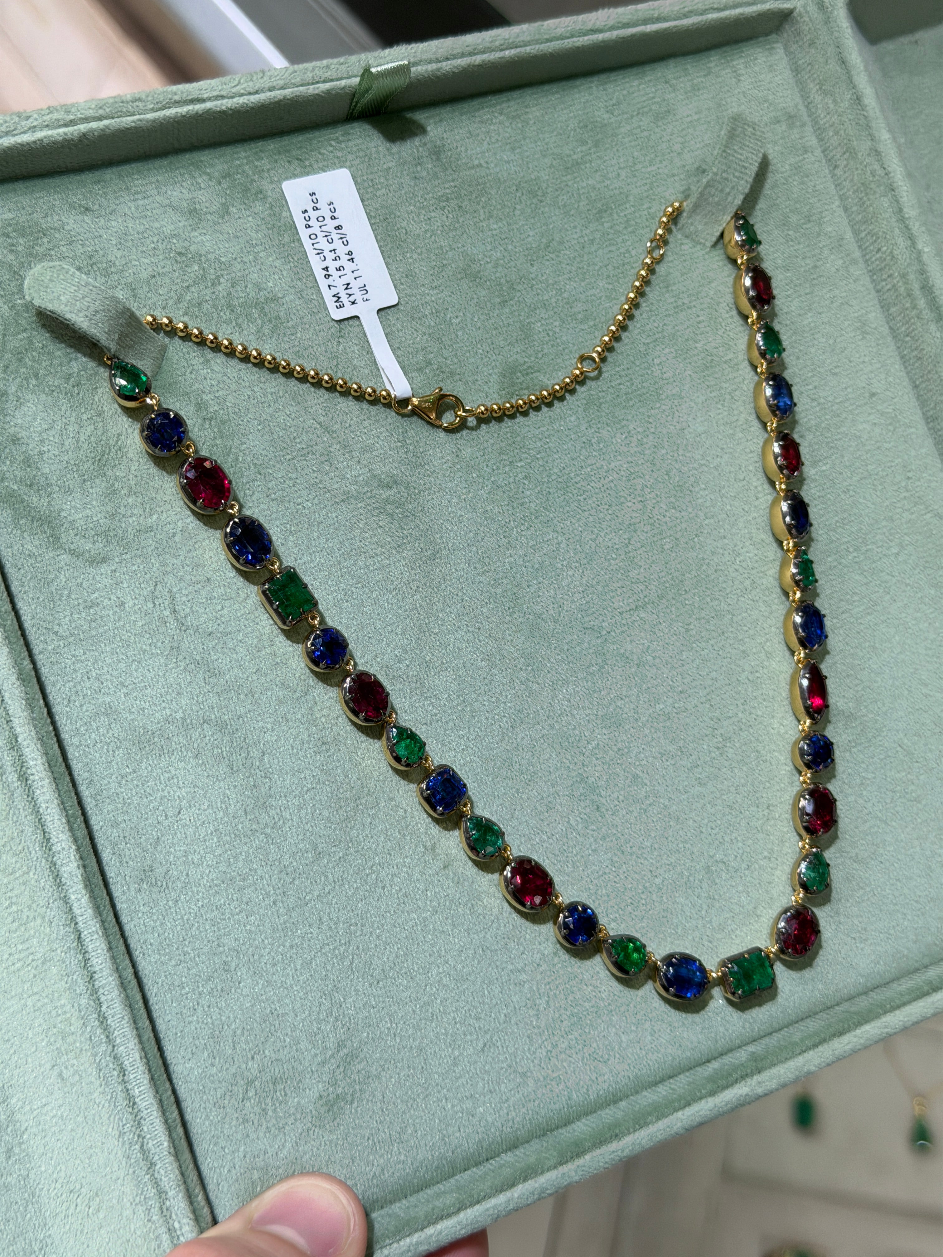 Silver 17-inch necklace featuring a 34.94tcw mixed color emerald, ruby, and kyanite gemstones in a polished cut design by JR Colombian Emeralds.