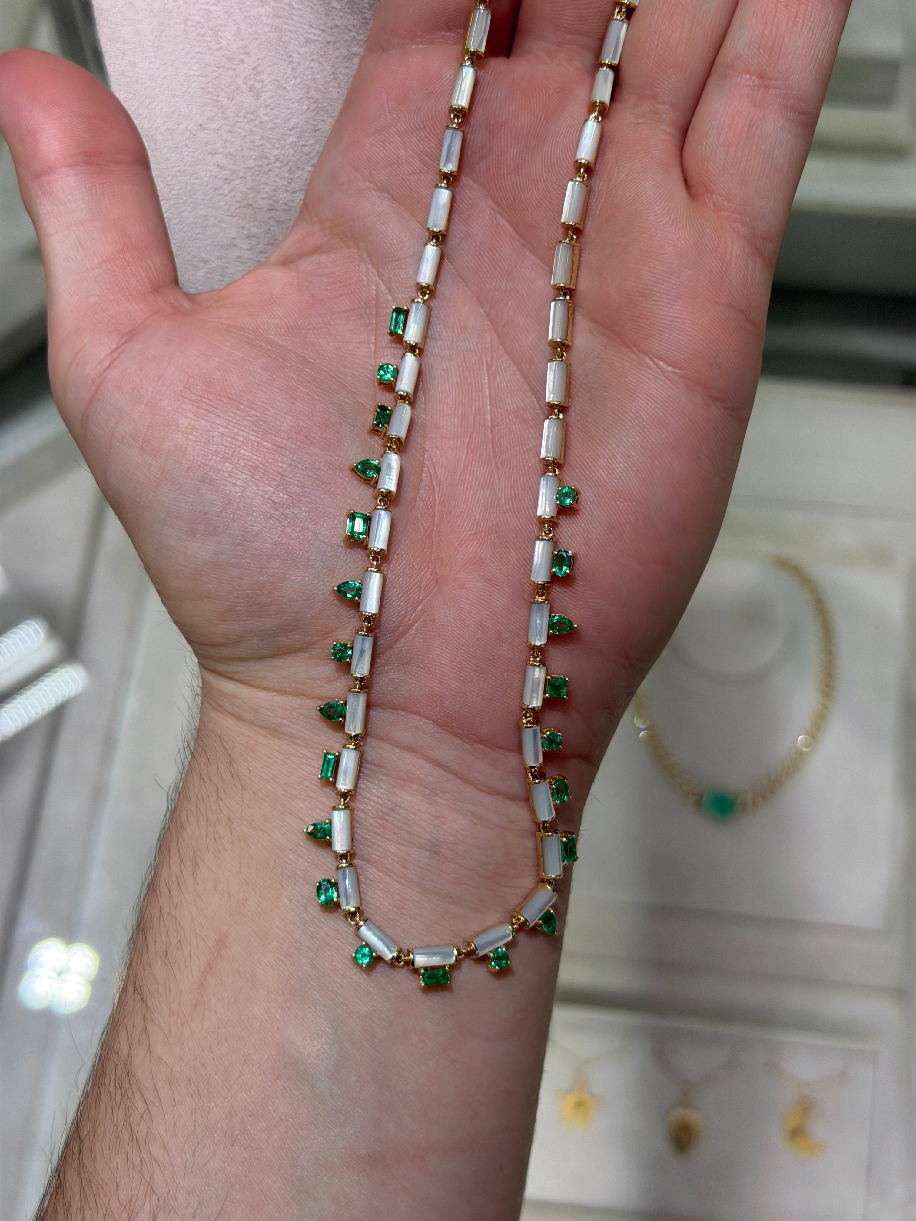 14K gold necklace with 22.68tcw mix cut emeralds and mother of pearl fringe, 18-inch length, by JR Colombian Emeralds.