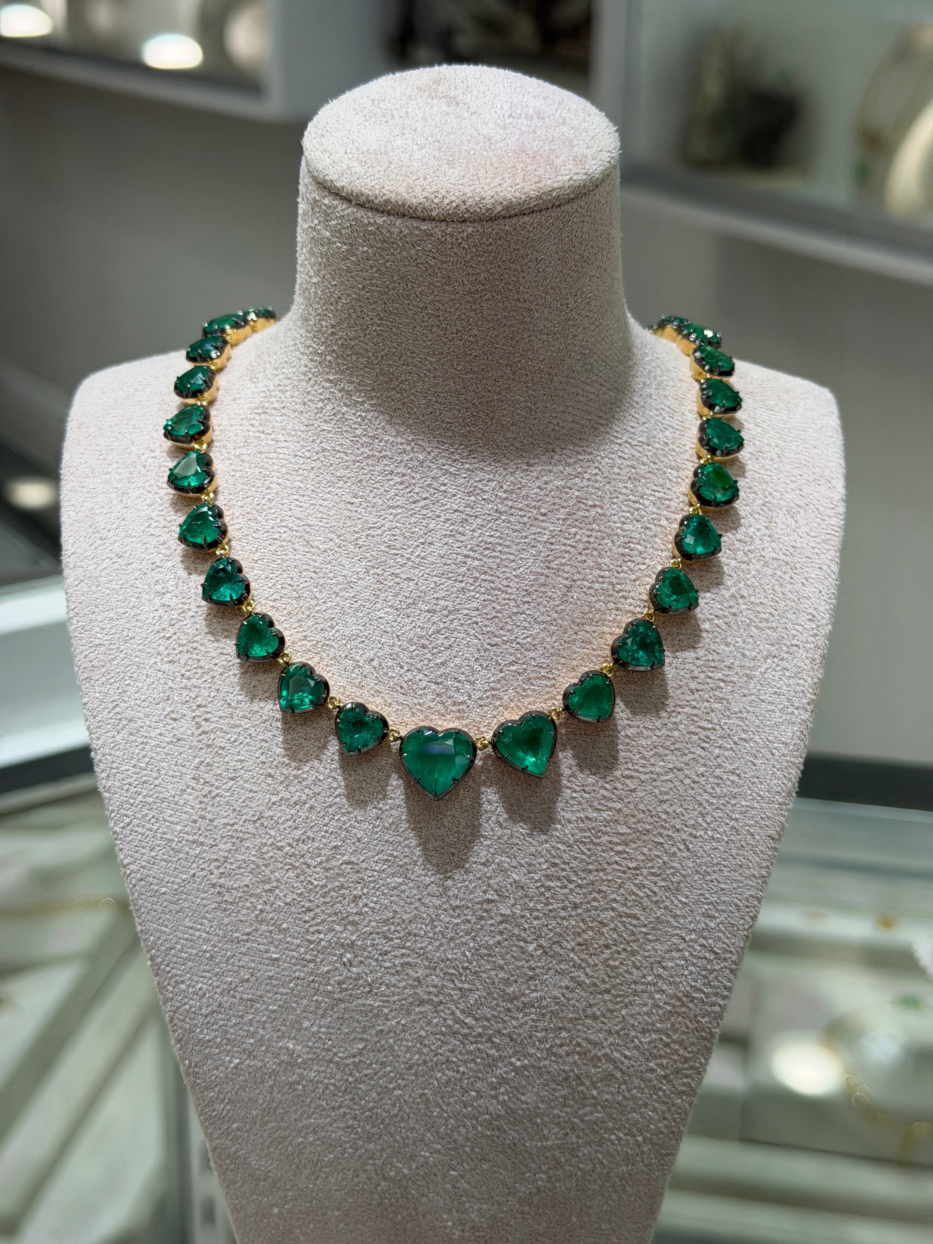 14K custom cut heart emerald tennis necklace with black rhodium, 18-inch length, featuring sparkling emeralds from JR Colombian Emeralds.