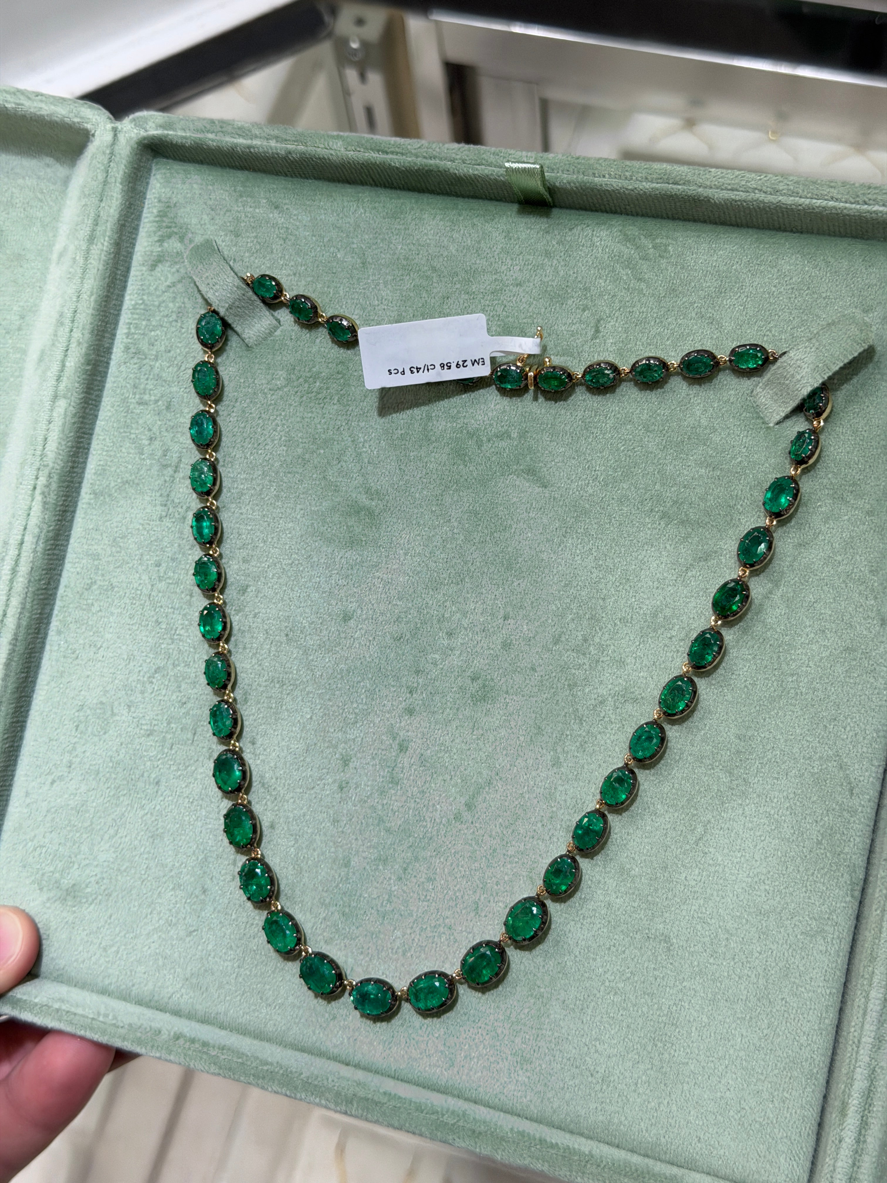 14K gold tennis necklace with 29.58tcw natural oval cut diamonds and black rhodium finish, 17-inch length, by JR Colombian Emeralds.