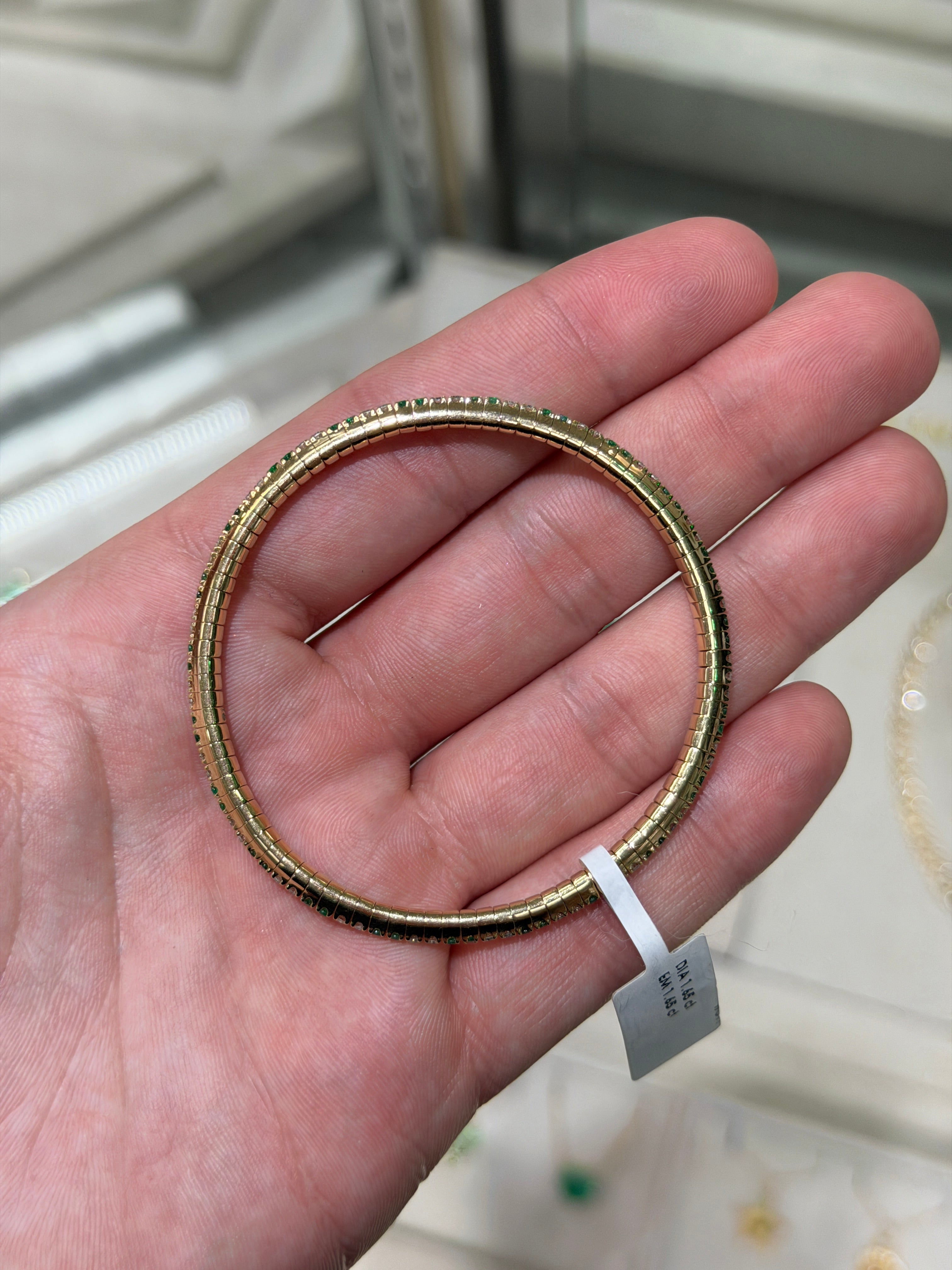 14K gold tennis bracelet with alternating natural emeralds and diamonds, prong set, stretchy design by JR Colombian Emeralds.