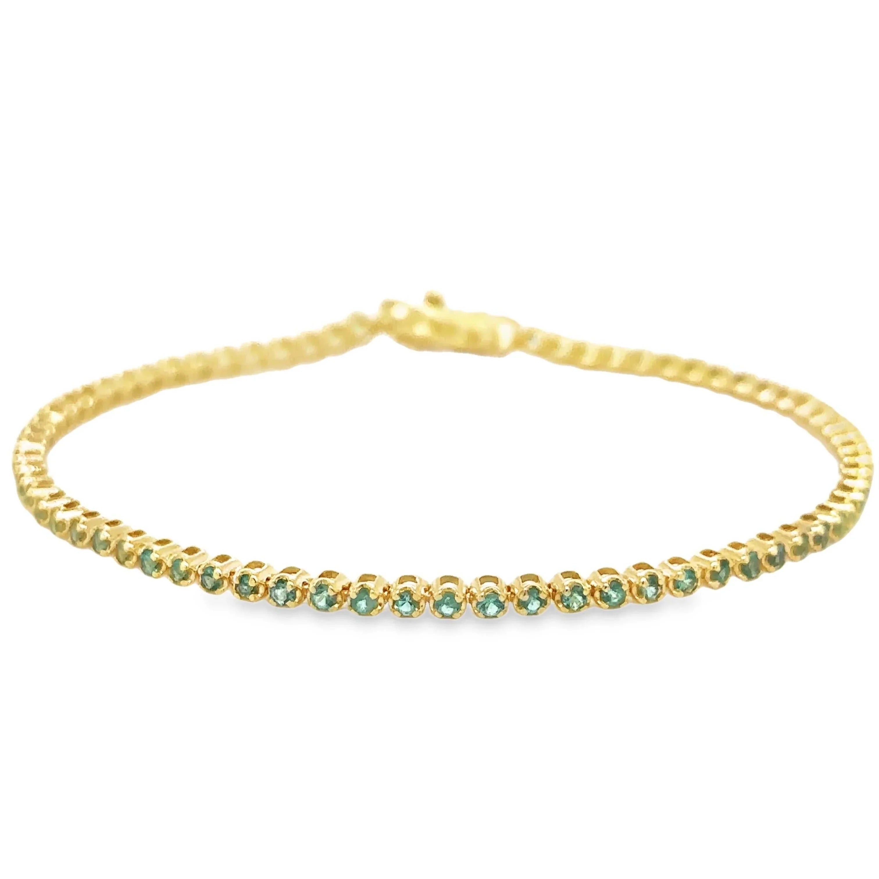 14K gold petite emerald tennis bracelet with 1.13 carat green emeralds, 7 inches long