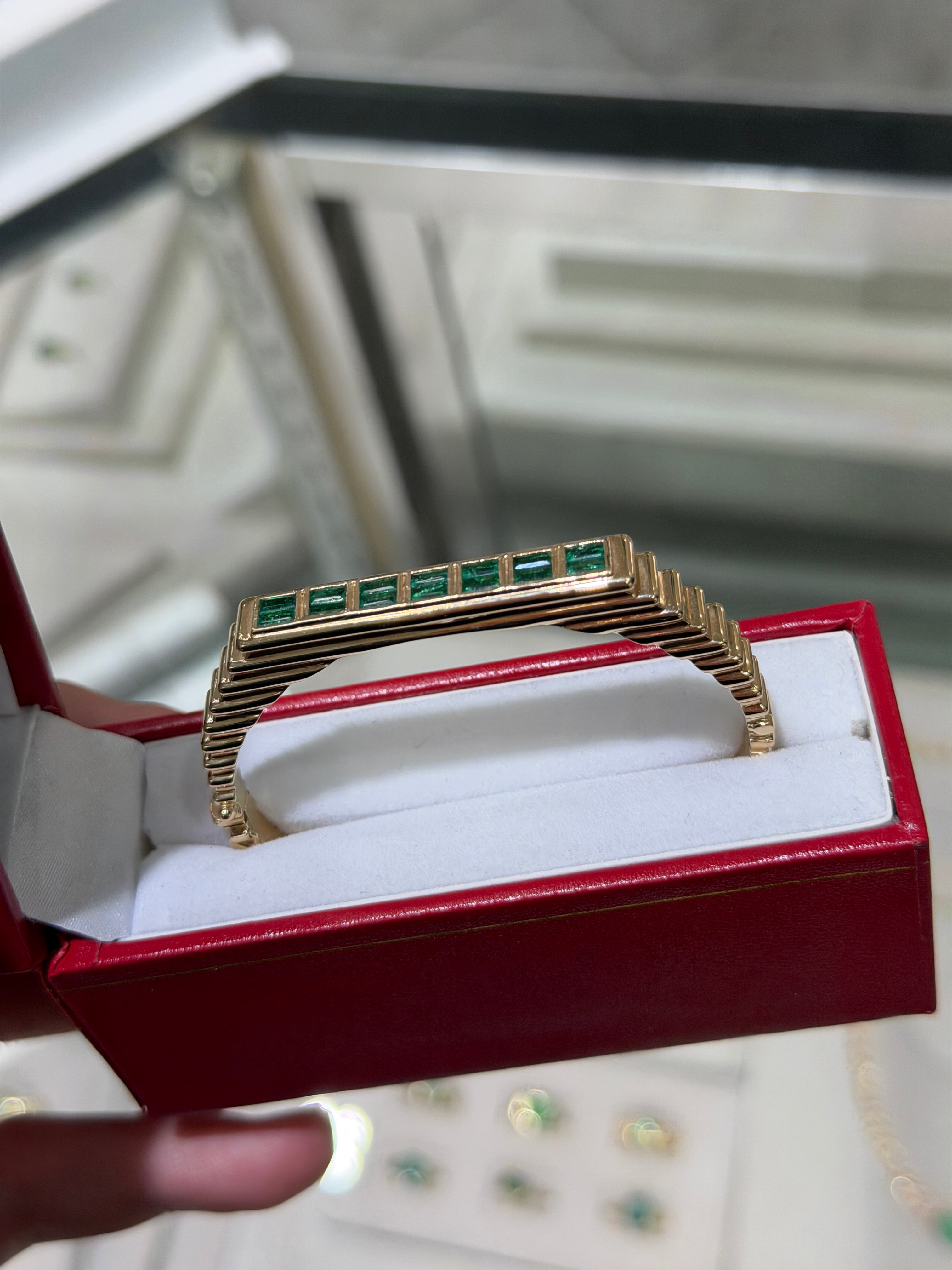 14K natural emerald bangle bracelet with princess cut stones, bezel set in ribbed design by JR Colombian Emeralds.