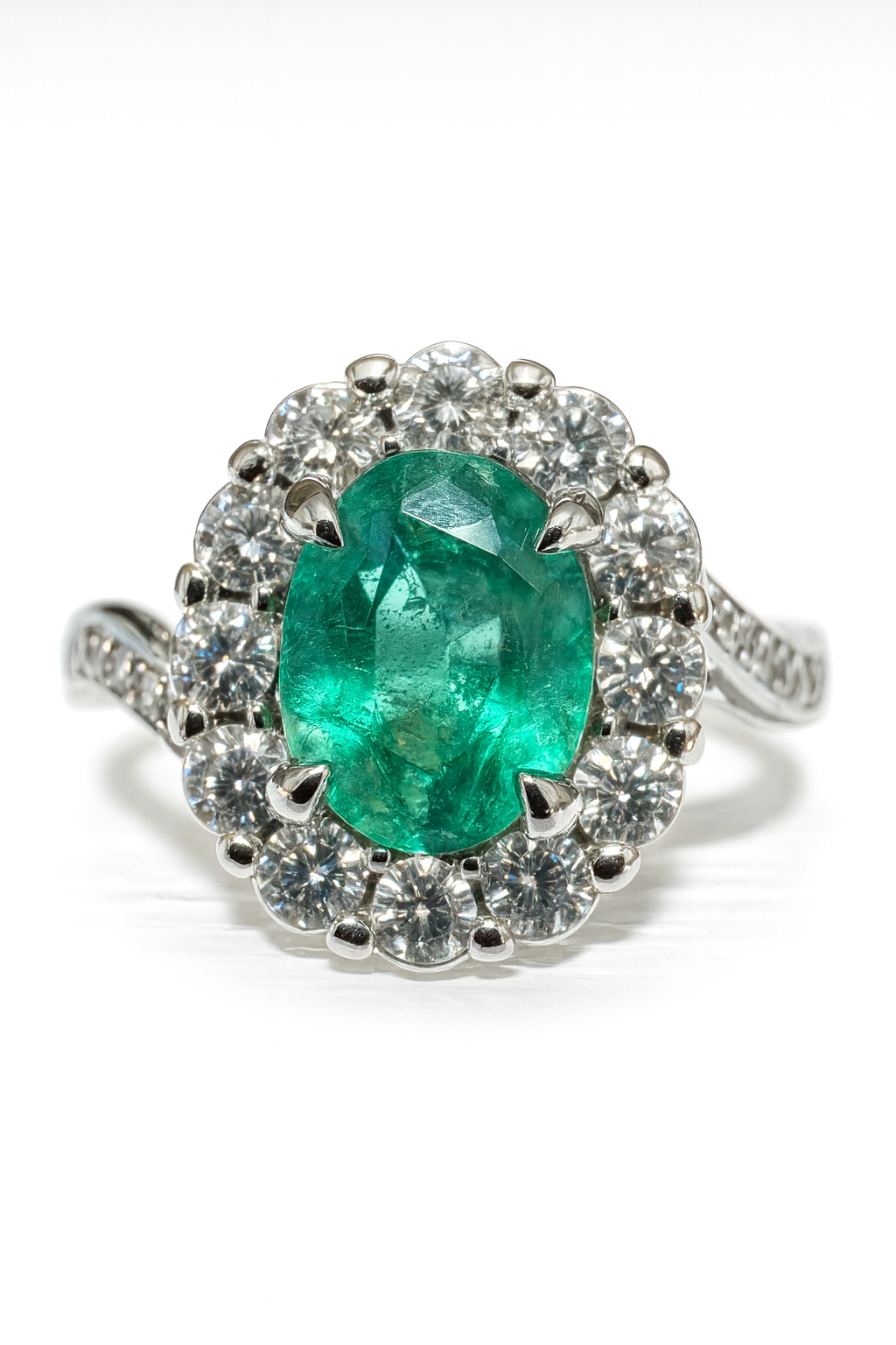 1.41tcw 14K white gold engagement ring with natural oval emerald center stone and diamond halo shank