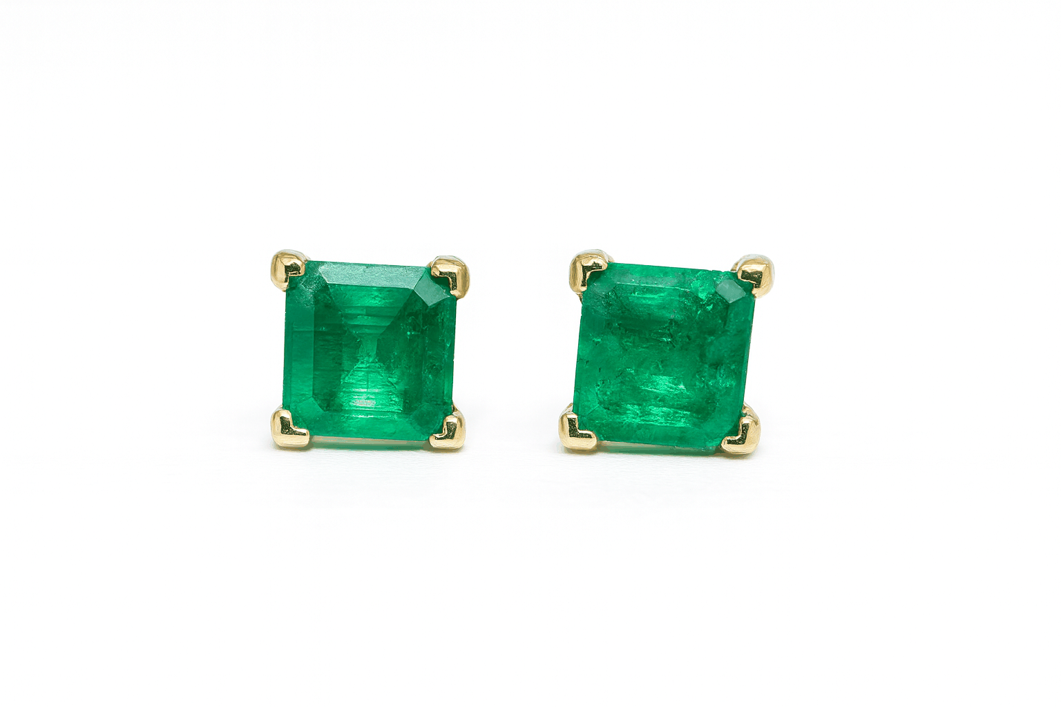 Princess cut emerald stud earrings set in 14K yellow gold
