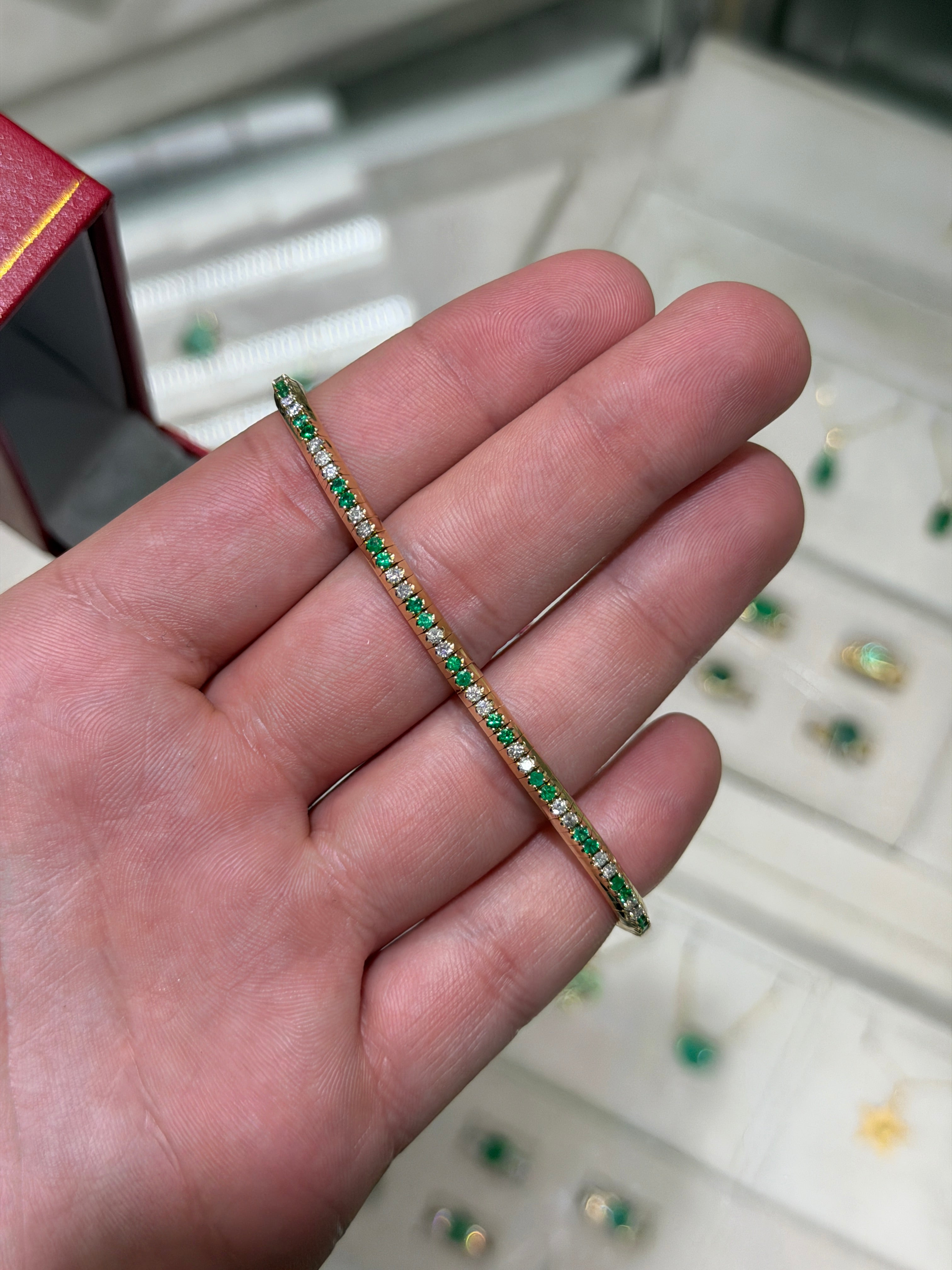 14K gold tennis bracelet with alternating natural emeralds and diamonds, prong set, stretchy design by JR Colombian Emeralds