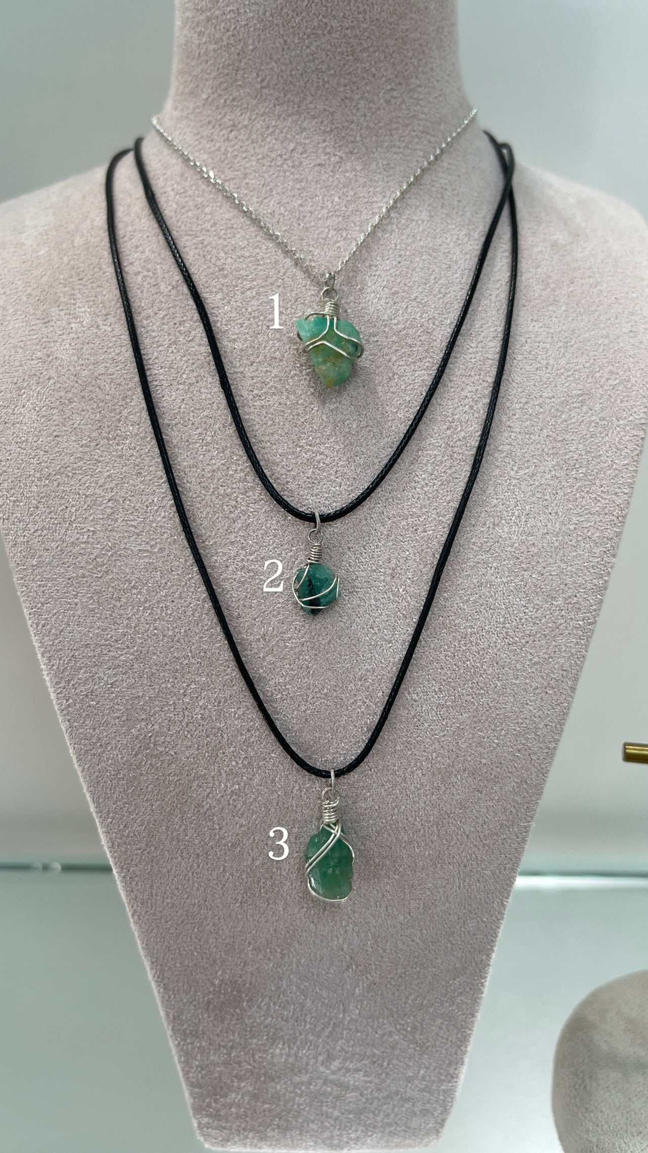 Natural rough Colombian emerald necklaces with sterling silver wire wrap and leather cords