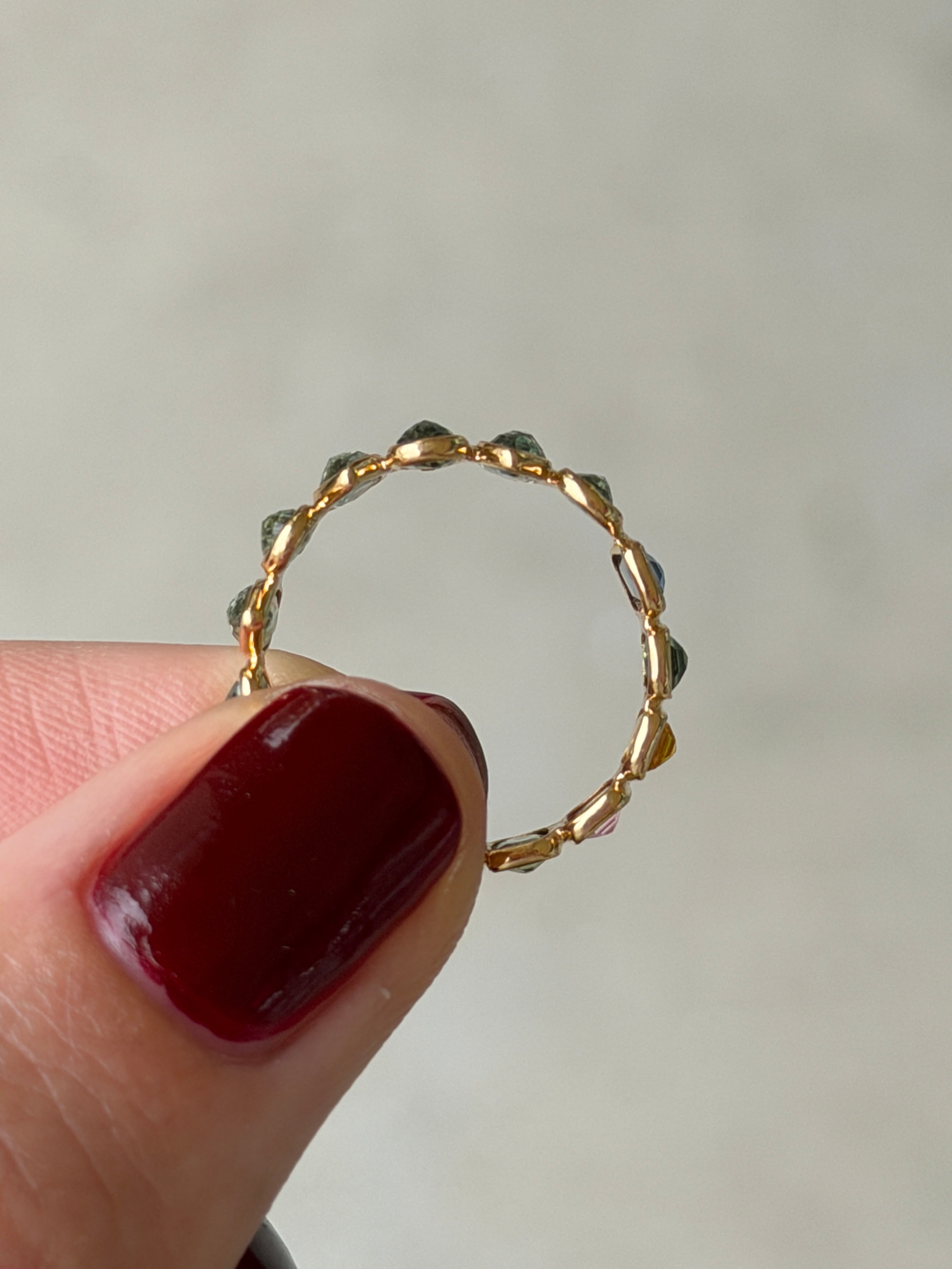 18K gold rainbow sapphire eternity band with pastel sapphires, inverted design, size 6.5, by JR Colombian Emeralds.