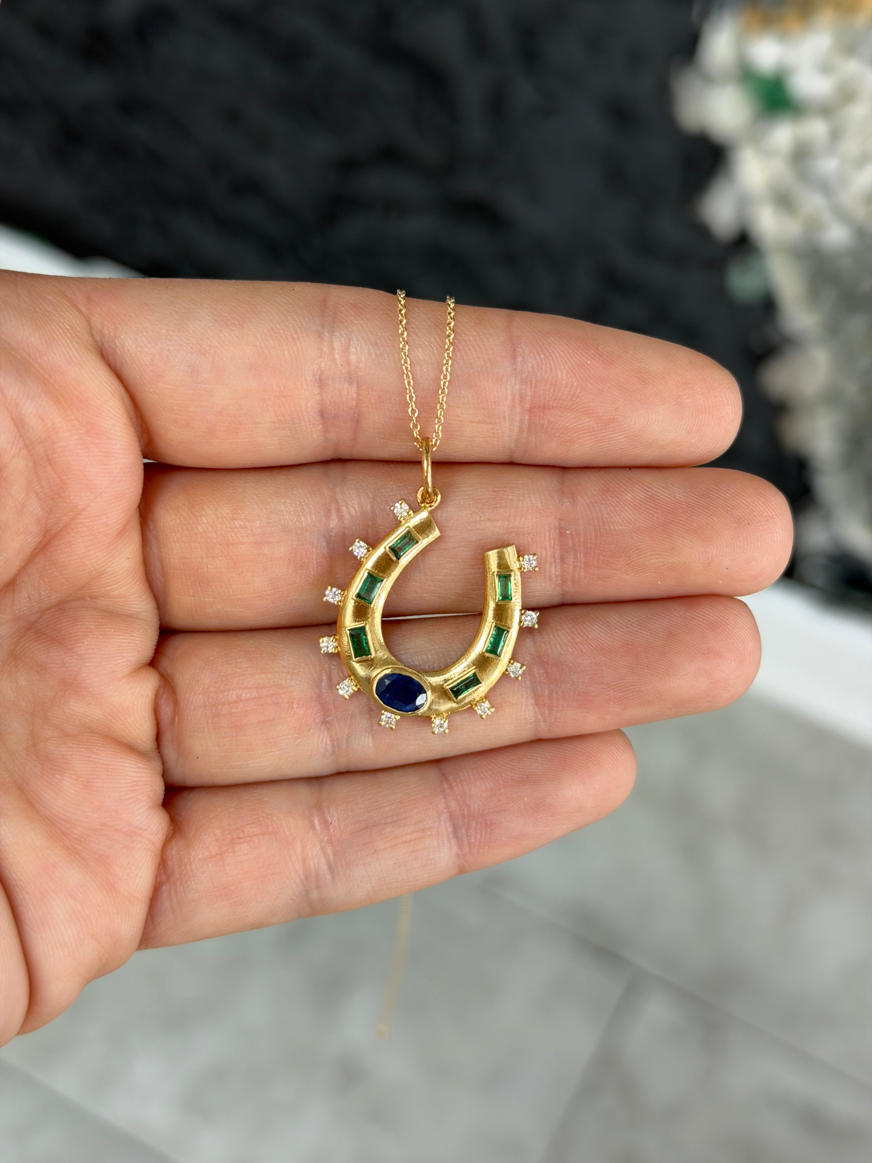 14K gold horseshoe charm pendant with 1.26tcw natural sapphire, emerald, and diamond accents from JR Colombian Emeralds.