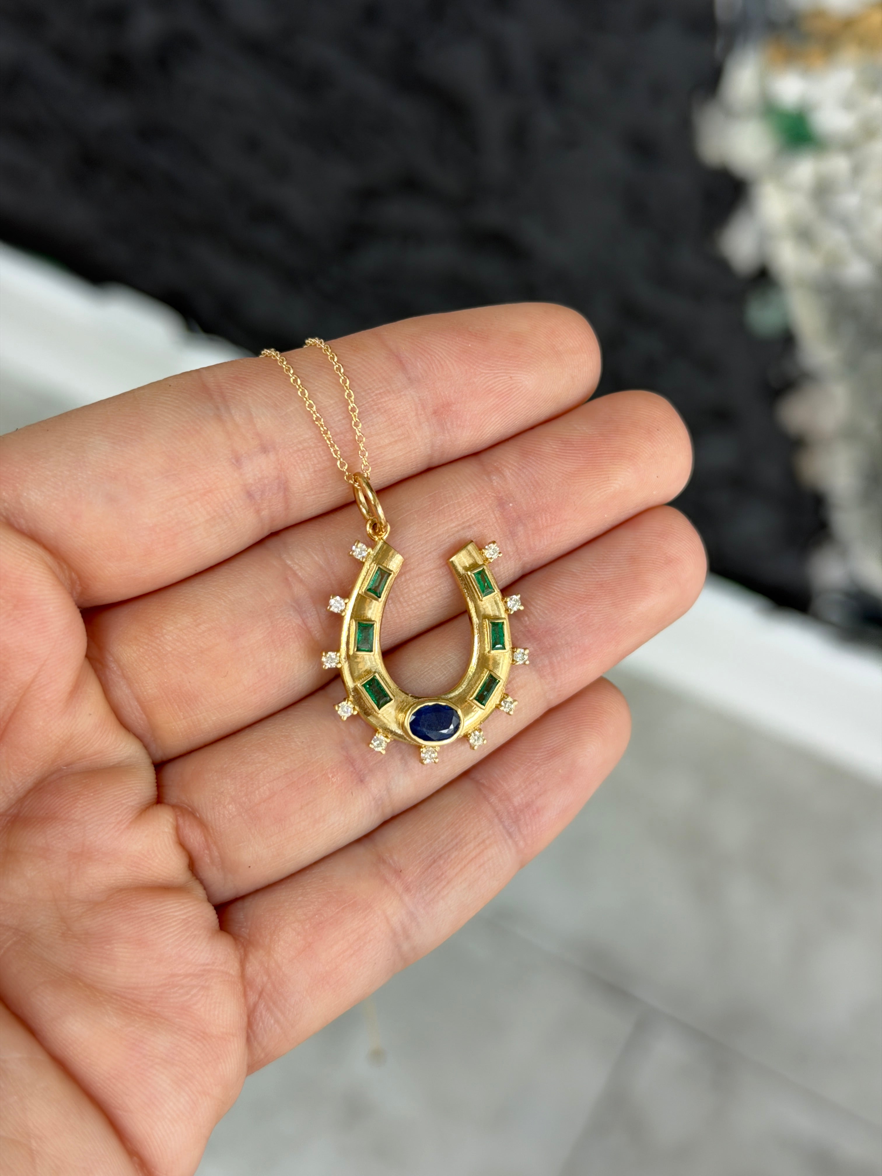 14K gold horseshoe charm pendant with 1.26tcw natural sapphire, emerald, and diamond accents, from JR Colombian Emeralds.