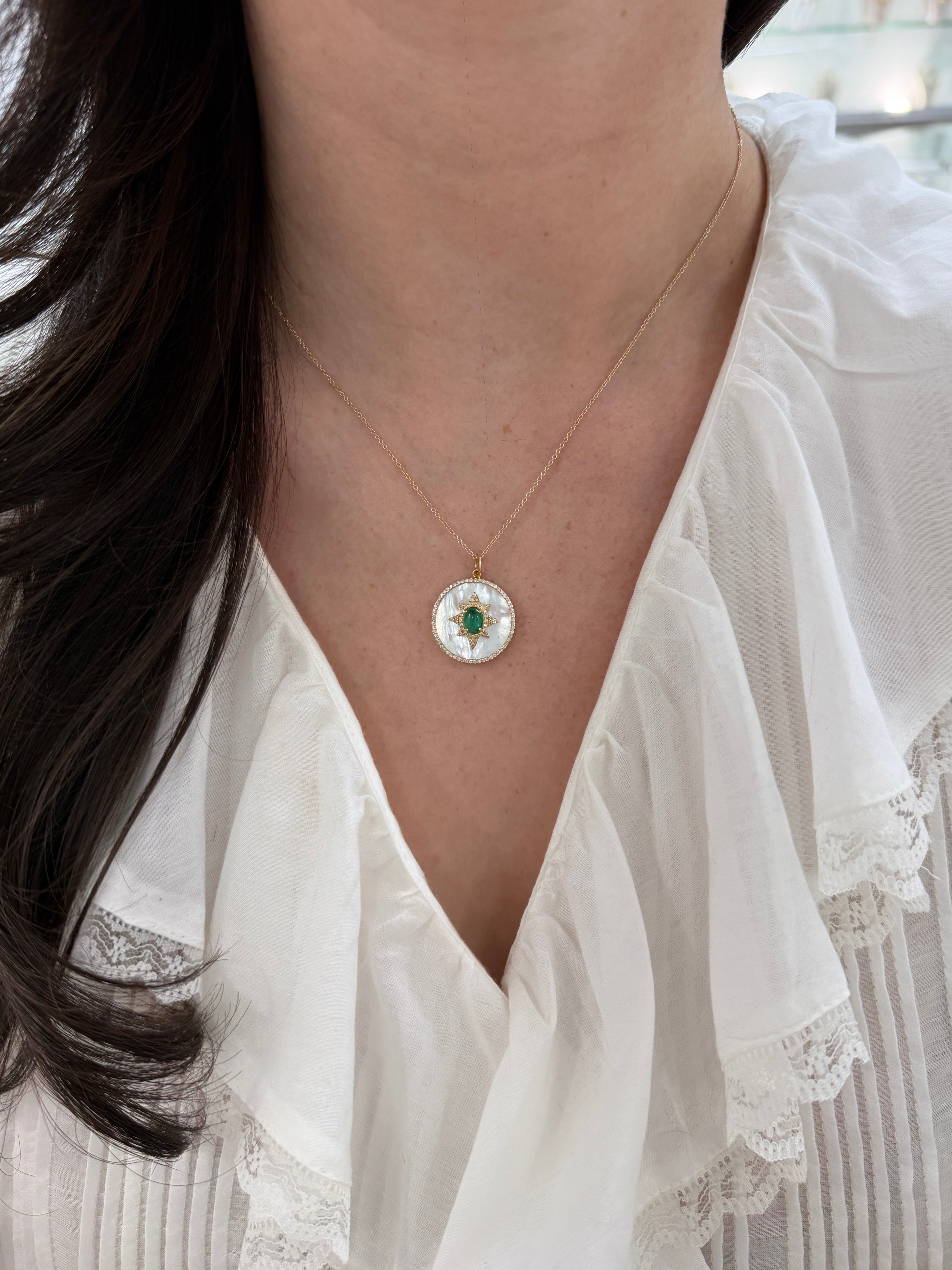 14K gold starburst medallion with emerald cabochon, mother of pearl, and diamond halo by JR Colombian Emeralds