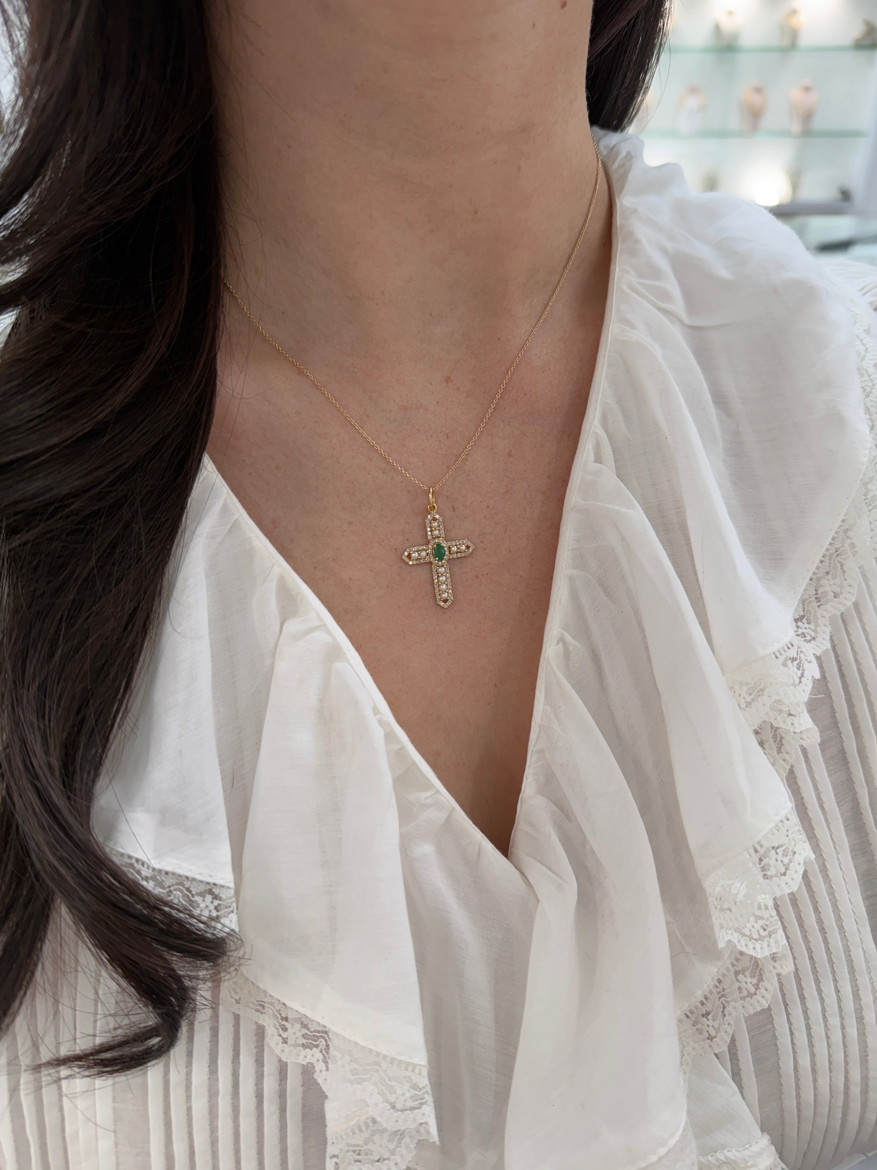 14K gold cross pendant with 1.54tcw emerald, diamonds, and pearls from JR Colombian Emeralds, featuring intricate gemstone details.