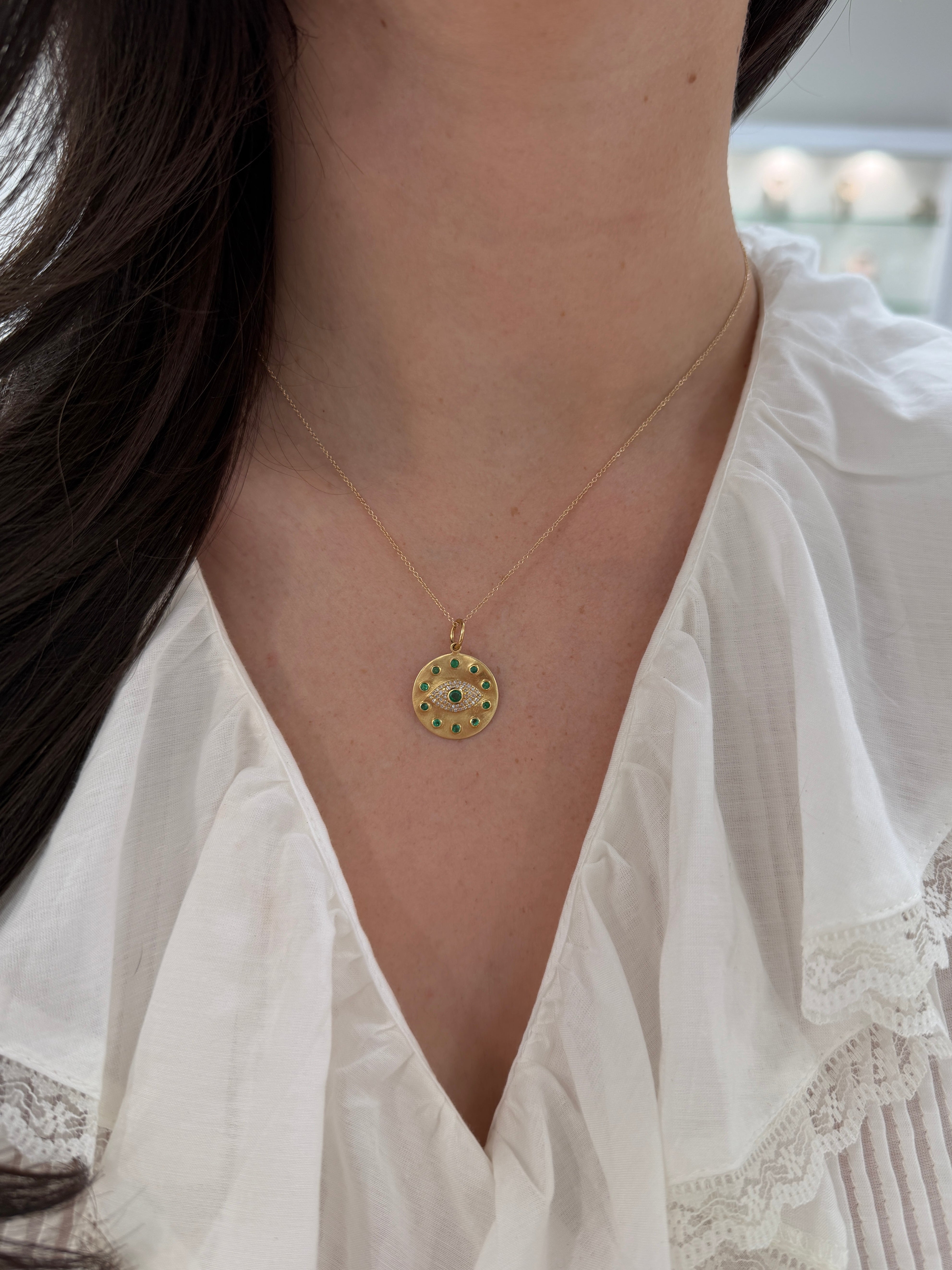 14K natural emerald and diamond evil eye protection charm pendant with 1.0tcw from JR Colombian Emeralds, showcasing intricate jewelry design.