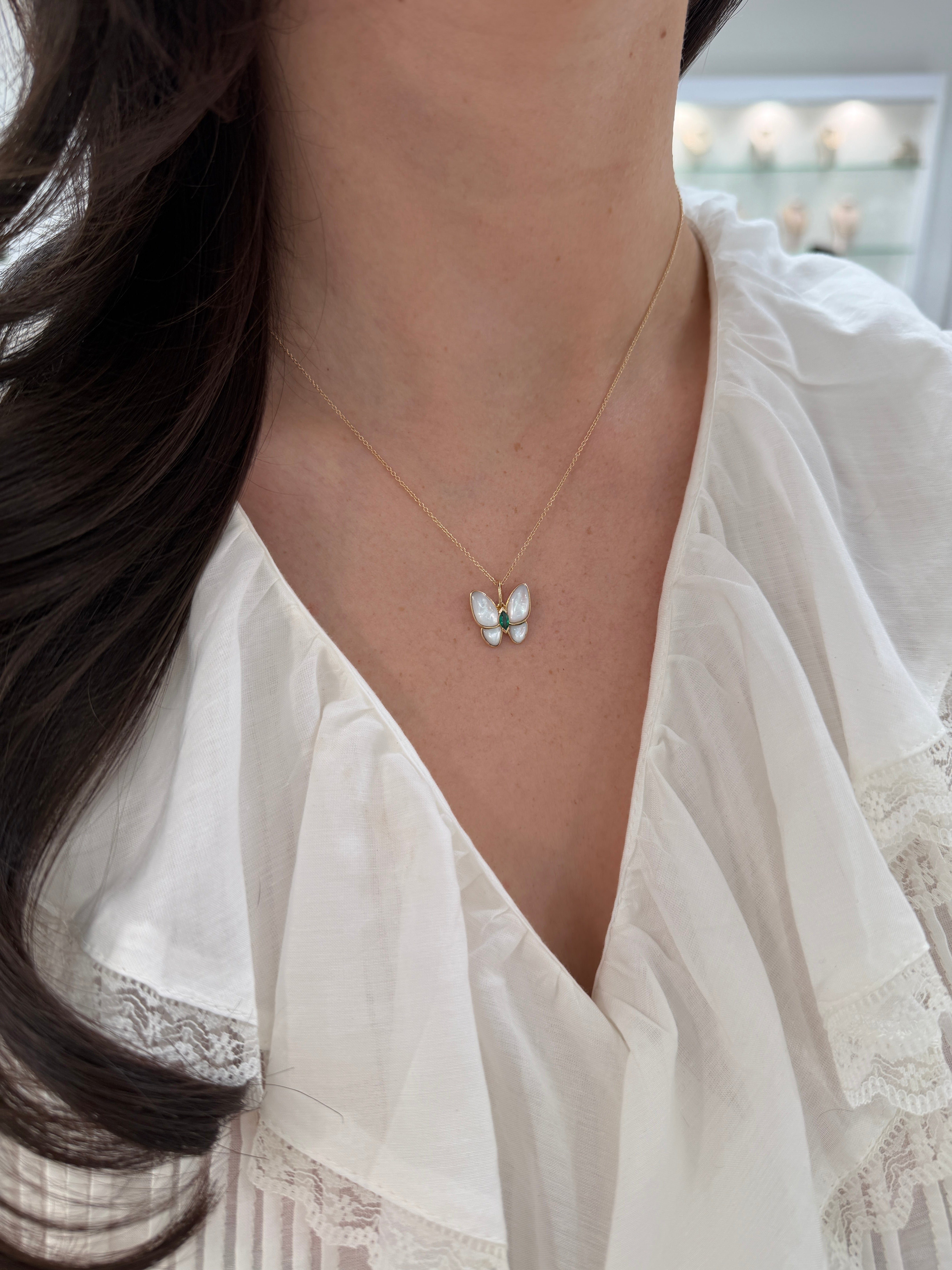 14K gold butterfly pendant with 2.90tcw marquise emeralds and mother of pearl accents, elegant jewelry by JR Colombian Emeralds.