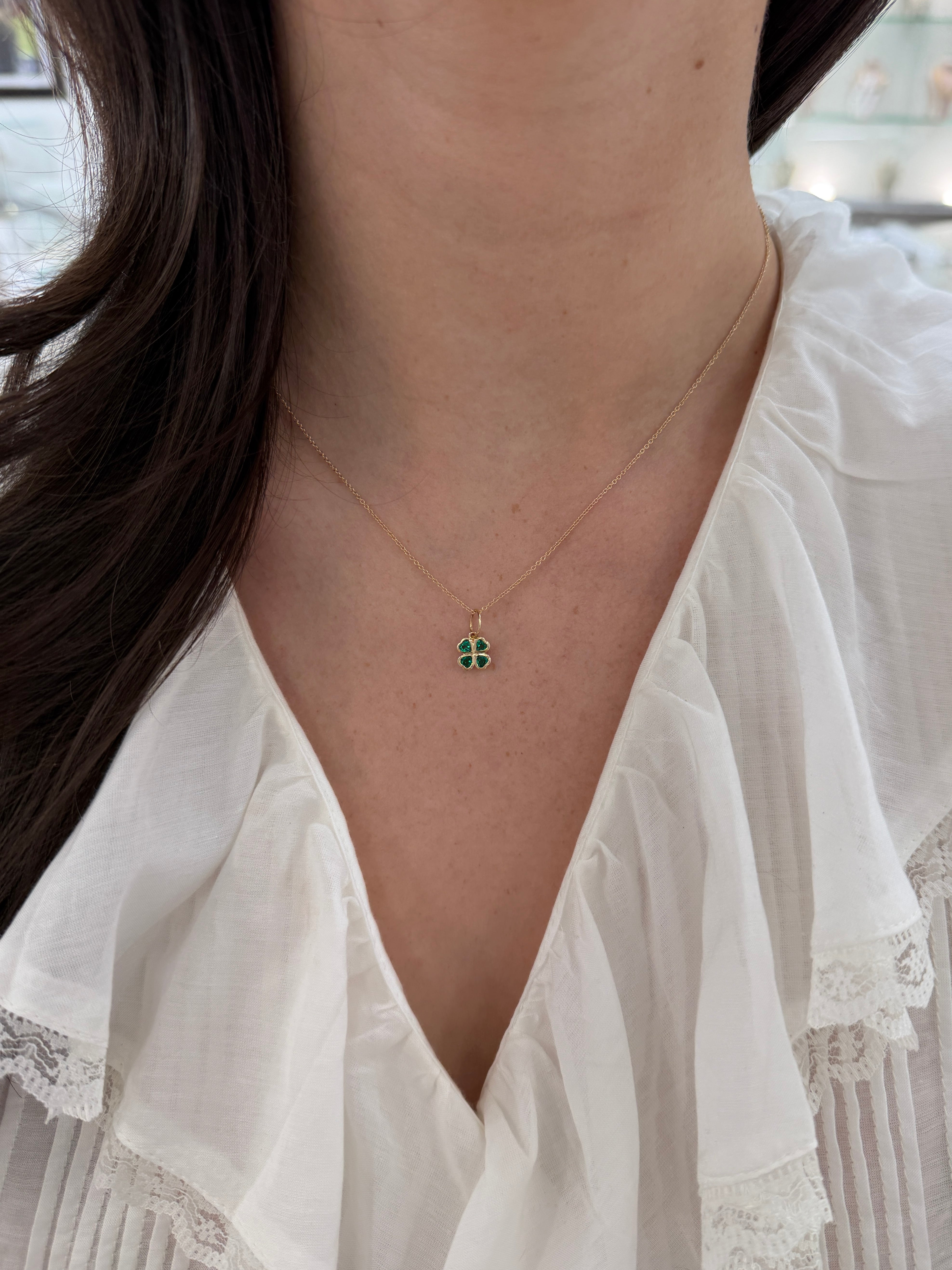 14K gold heart-shaped emerald clover charm pendant with 0.44tcw AAA+ quality emeralds, crafted by JR Colombian Emeralds.