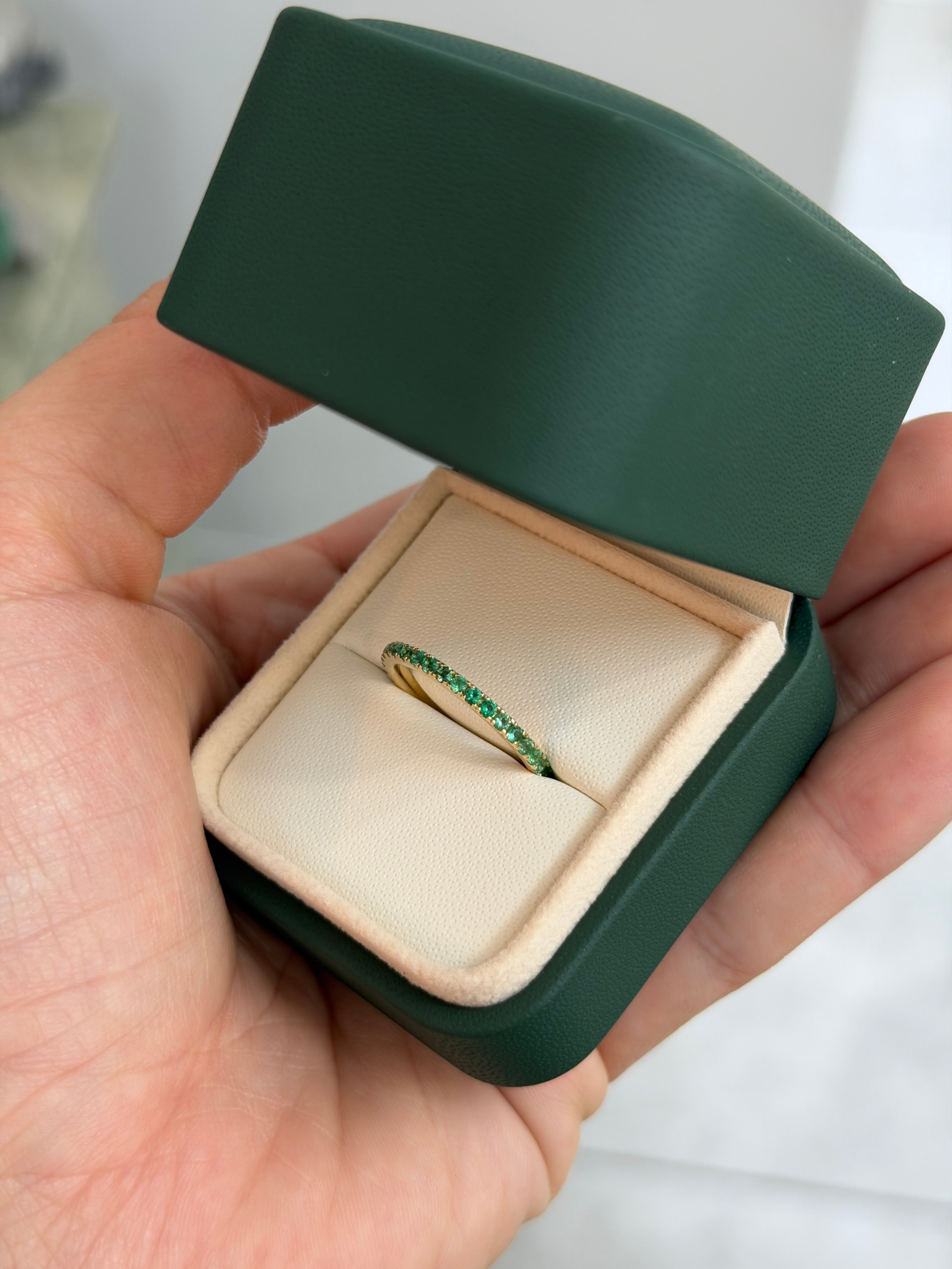 14K gold natural emerald eternity band with 0.70 carats total weight, available in 6, 7, and 8 sizes by JR Colombian Emeralds.