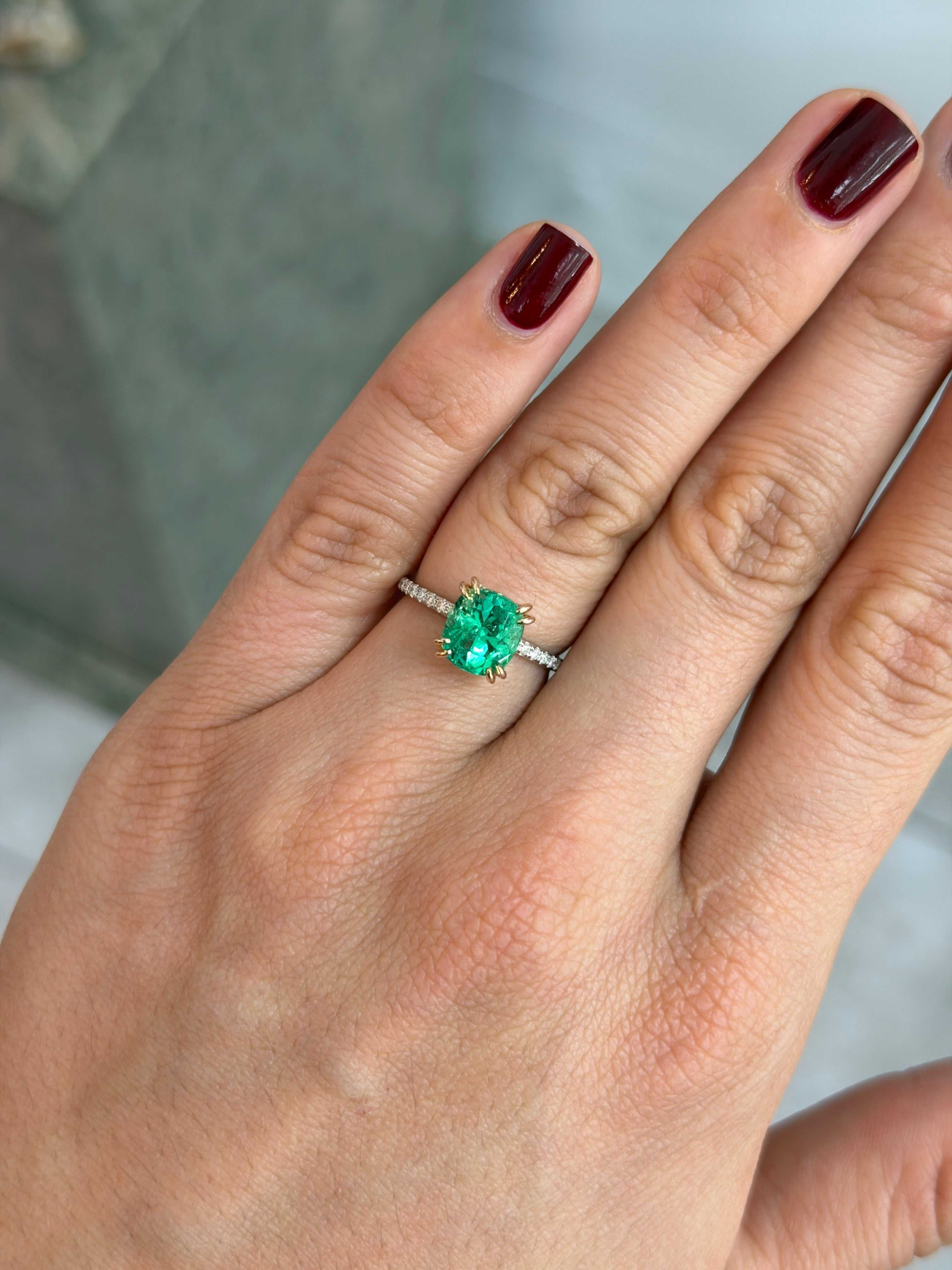 14K engagement ring featuring a 2.58ct cushion-cut natural emerald with diamond accents, showcasing elegant jewelry craftsmanship.
