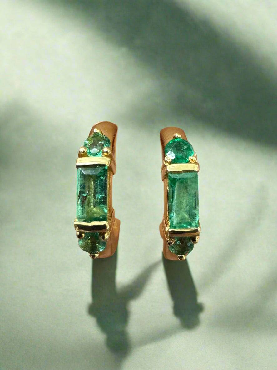 Petite natural emerald half hoop earrings with baguette and round cuts set in 14K gold