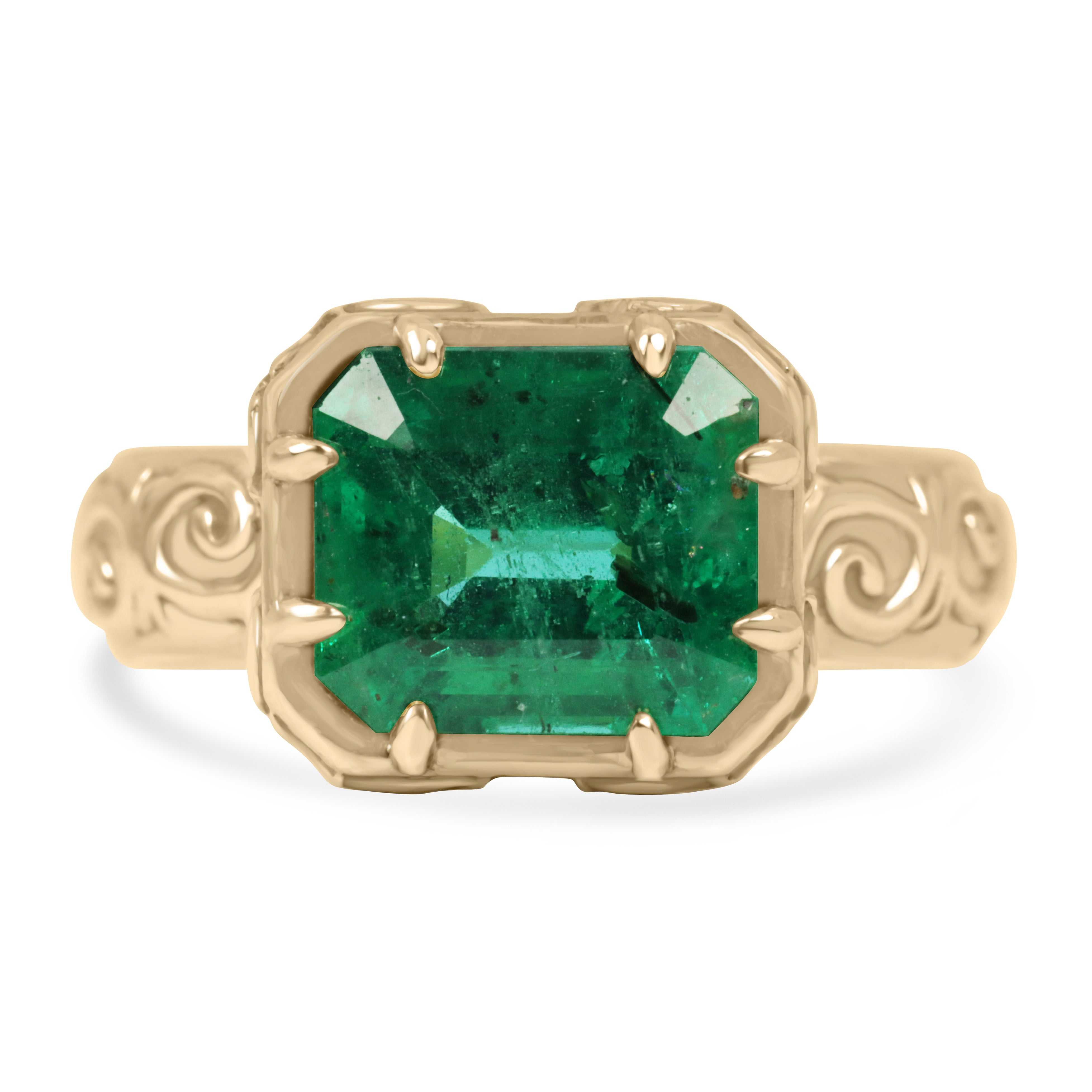 3.65ct emerald cut freckled emerald ring in 14K yellow gold with scroll etch design