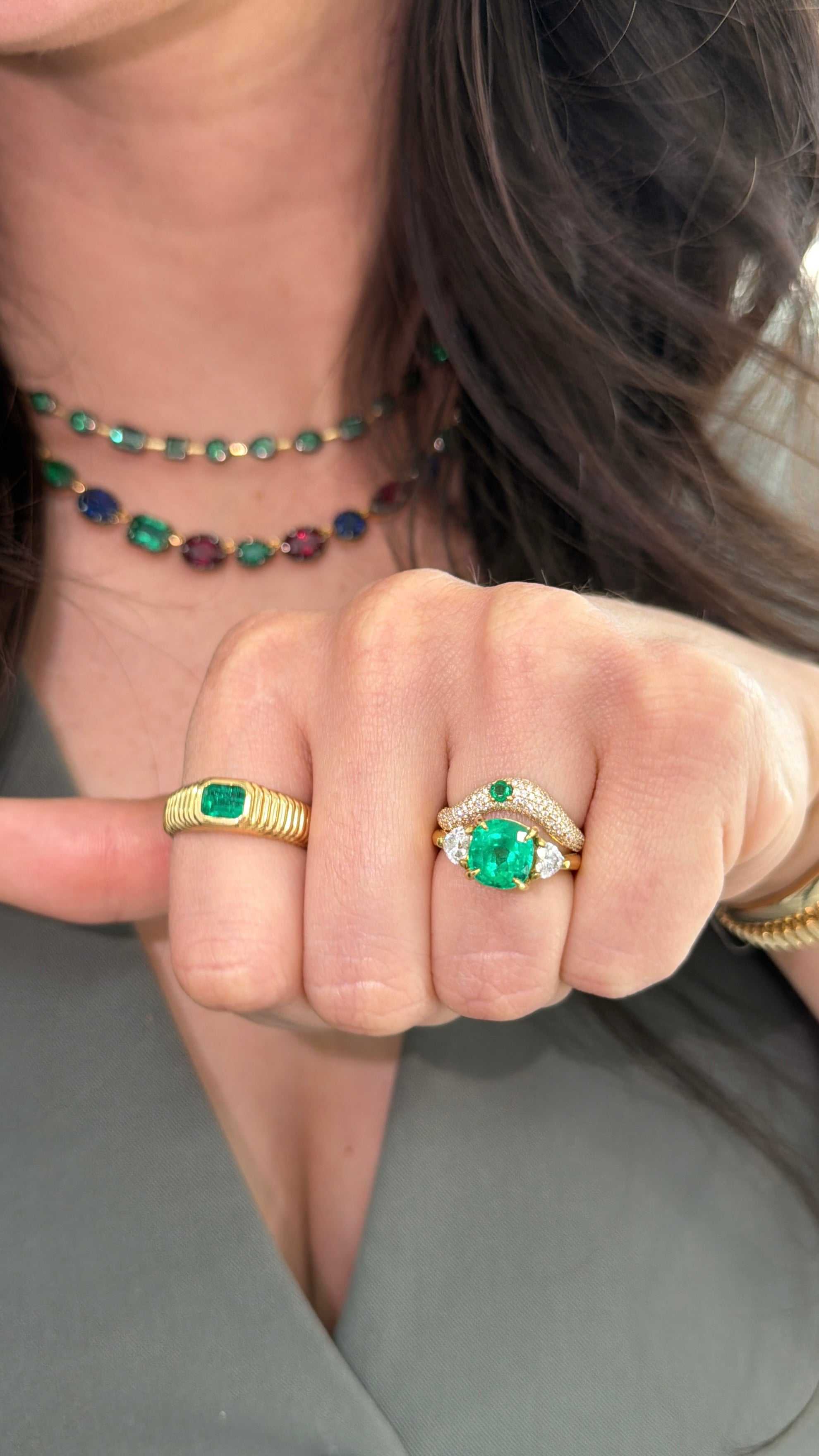 Vivid Colombian cushion emerald and romantic diamond engagement ring in 18K gold, showcasing a lush green emerald and sparkling diamonds.