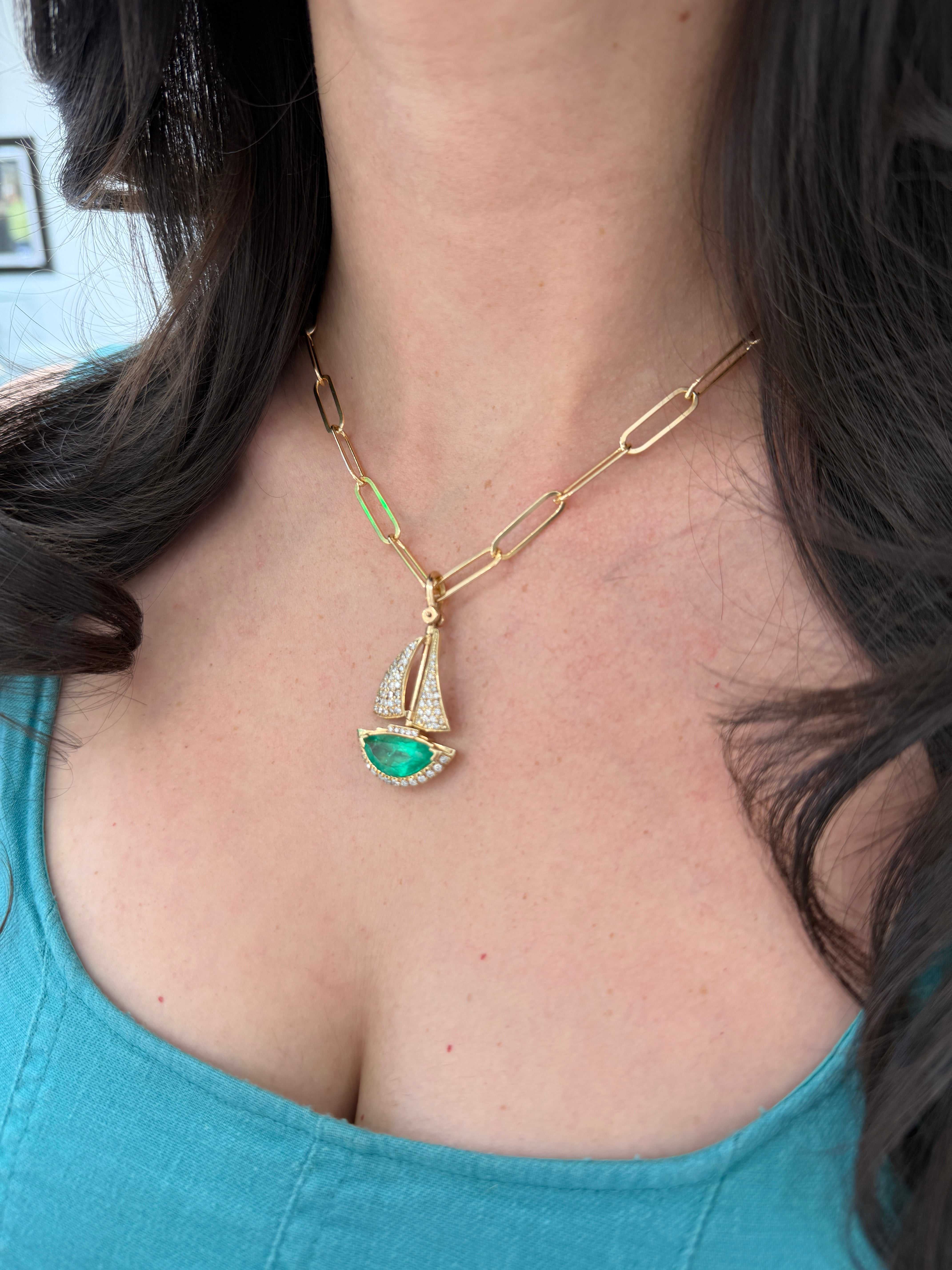 Handmade 14K gold pendant featuring a 6.61tcw AAA Colombian emerald half moon and diamond accents, inspired by a sailboat design.