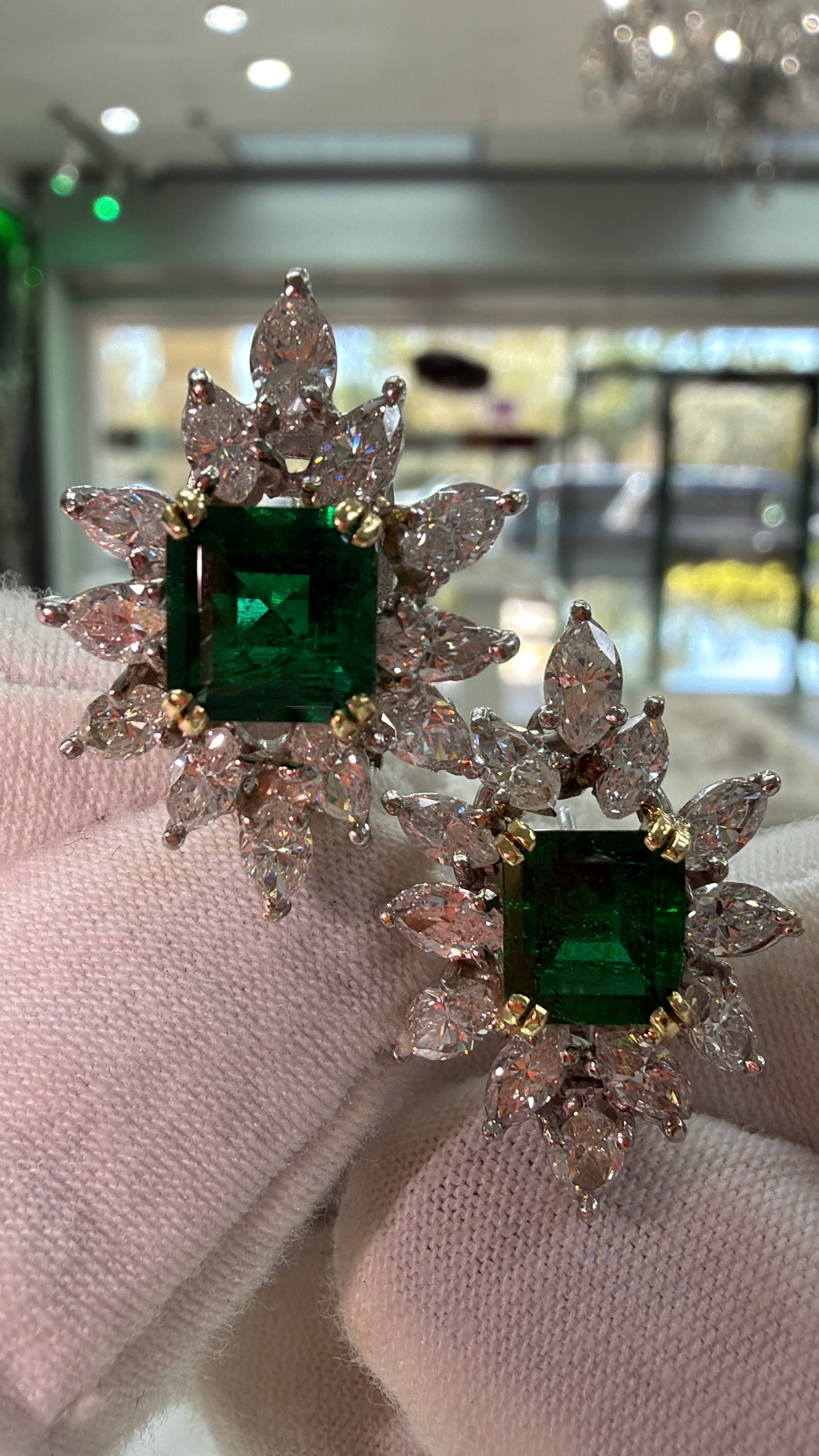 18K gold cocktail earrings featuring 7.92 carats of rich emeralds and diamonds in a starburst design by JR Colombian Emeralds.
