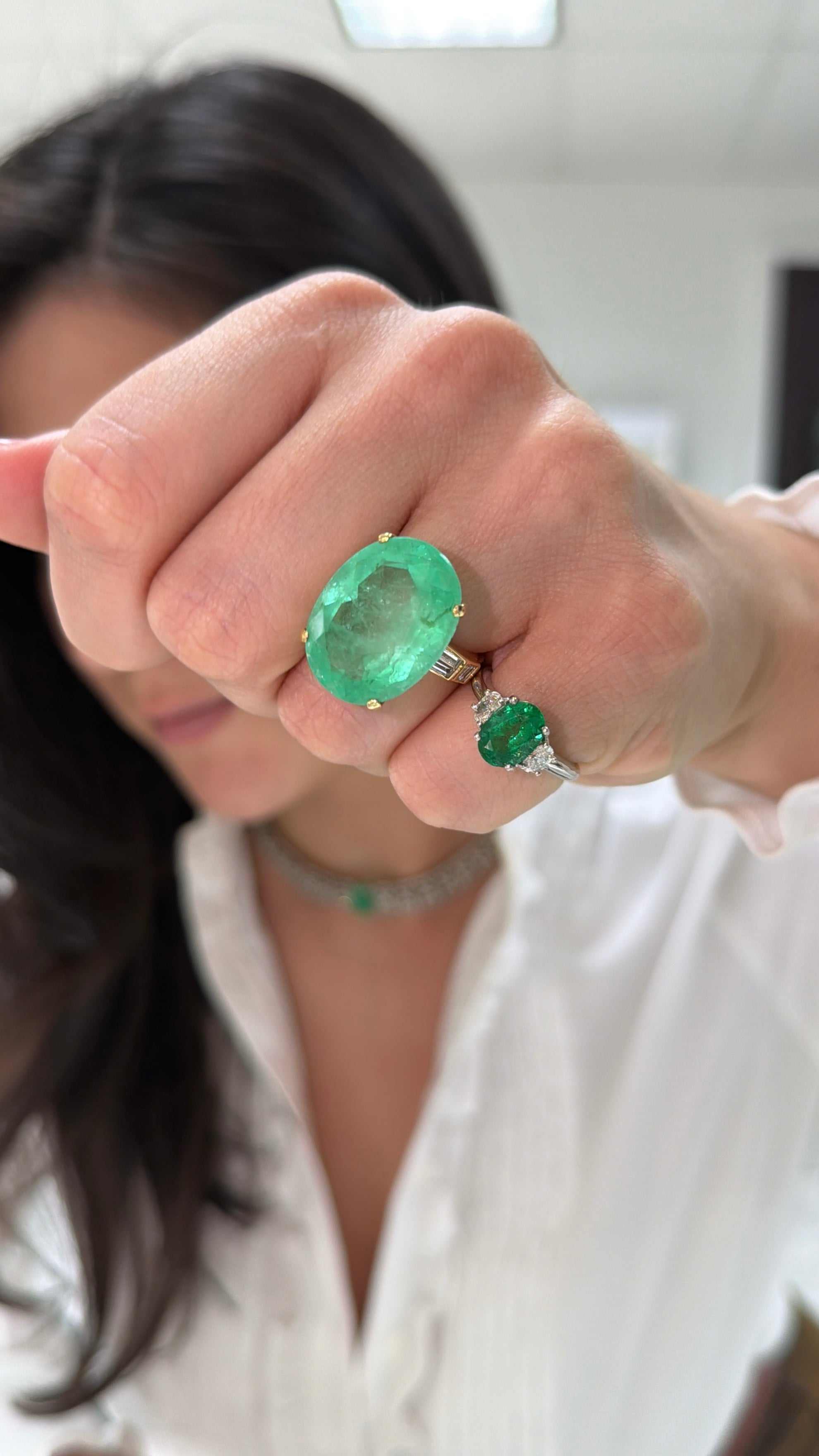 Ladies emerald ring featuring a 21.12 tcw oval cut Colombian emerald with diamond accents, set in 14K gold by JR Colombian Emeralds.