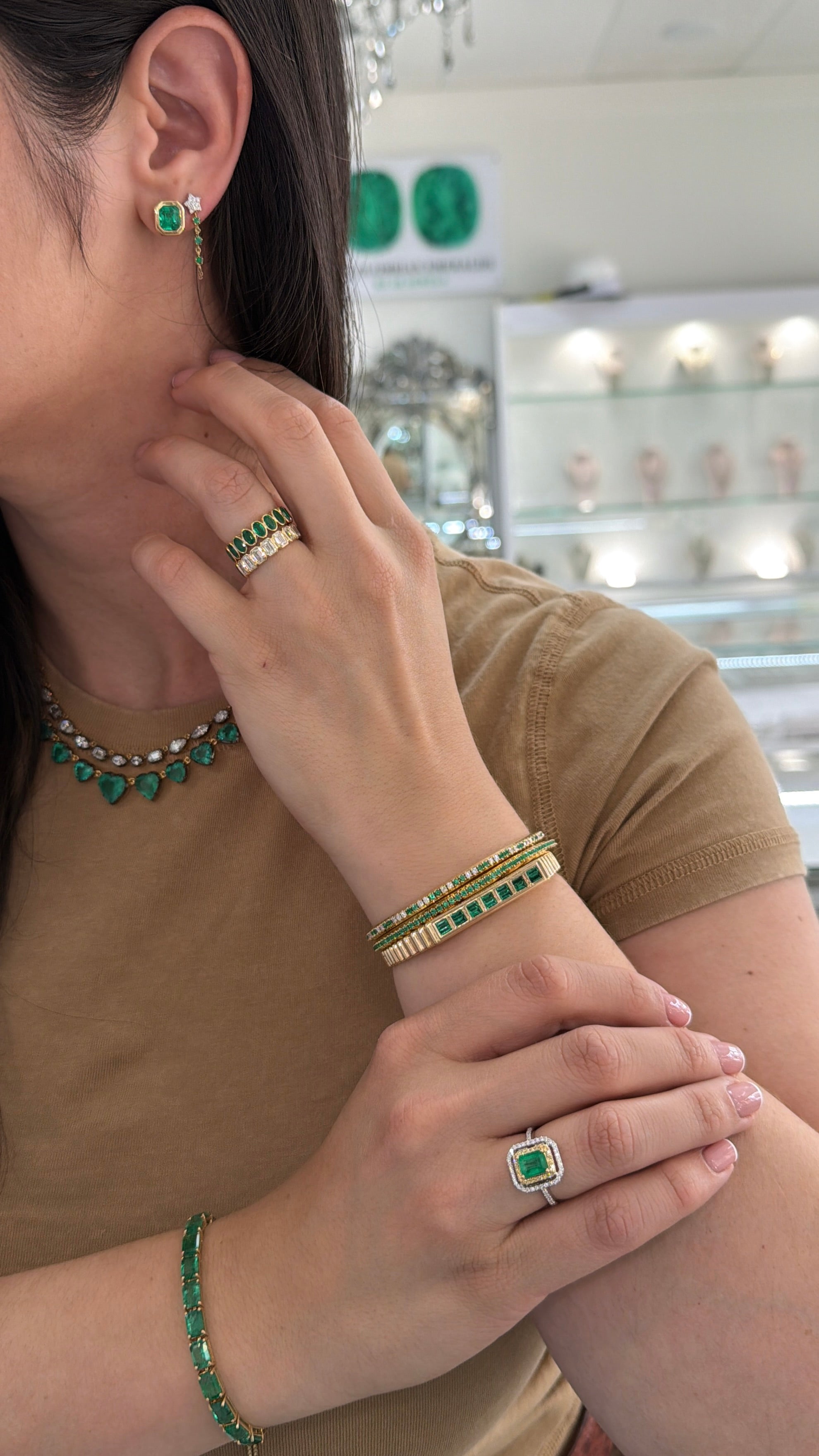 Close-up of JR Colombian Emeralds 14K gold ring featuring a 1.65tcw Colombian emerald center stone with yellow diamond halo.