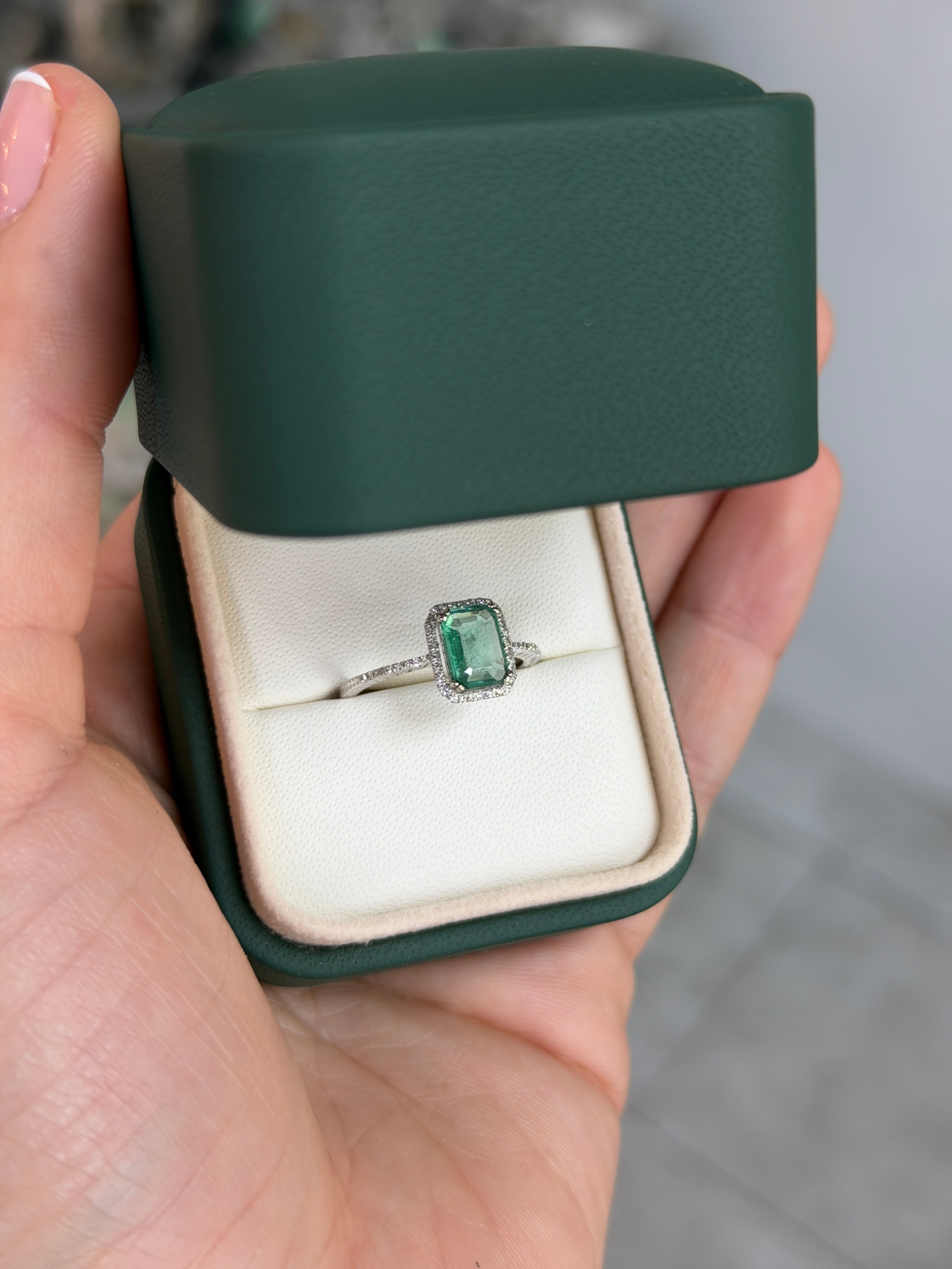 10x7.5mm emerald and diamond halo engagement ring in 14K white gold with crystal clear clarity, by JR Colombian Emeralds.
