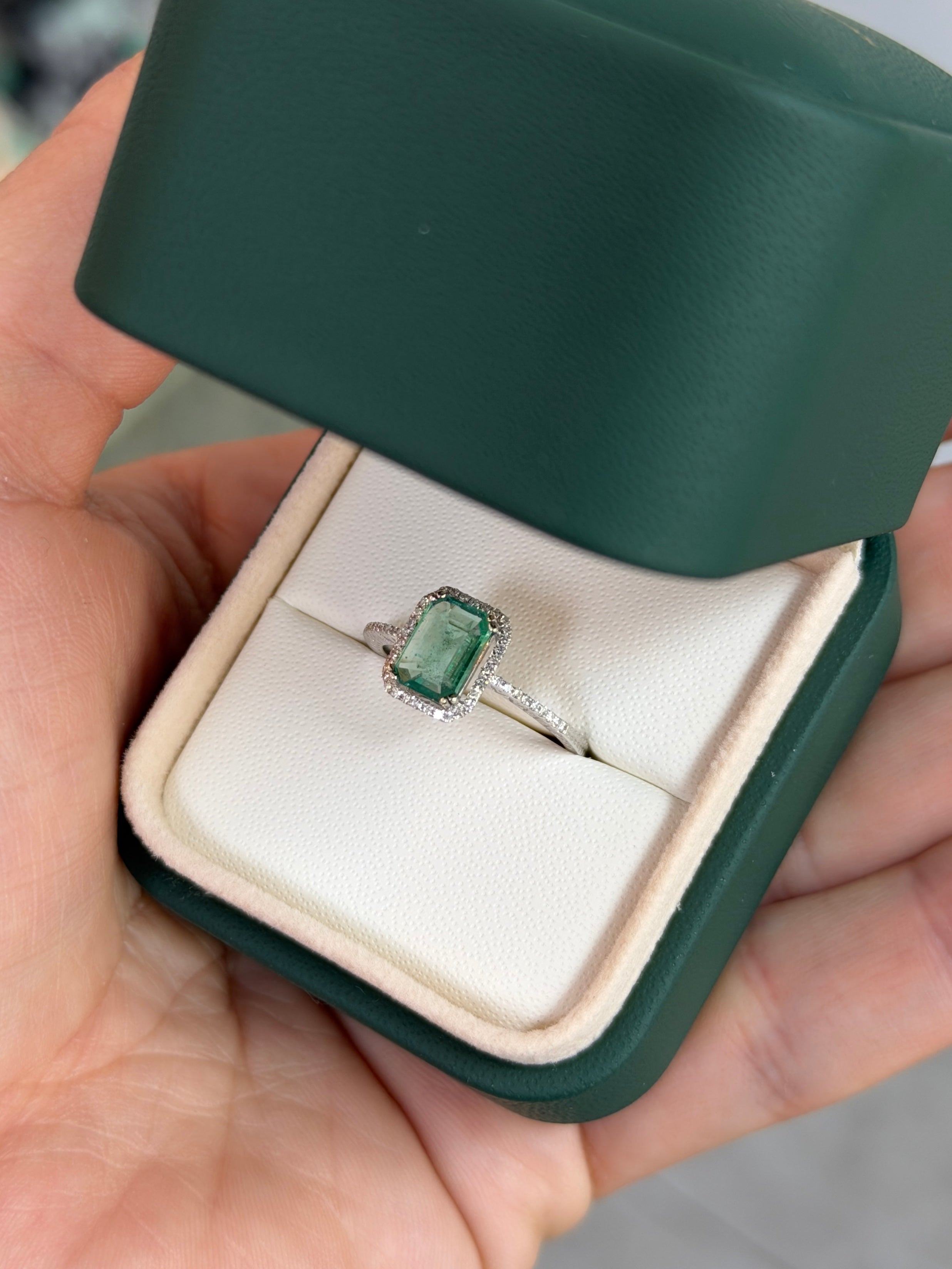 10x7.5mm emerald and diamond halo engagement ring in 14K white gold with clear gemstones, by JR Colombian Emeralds.