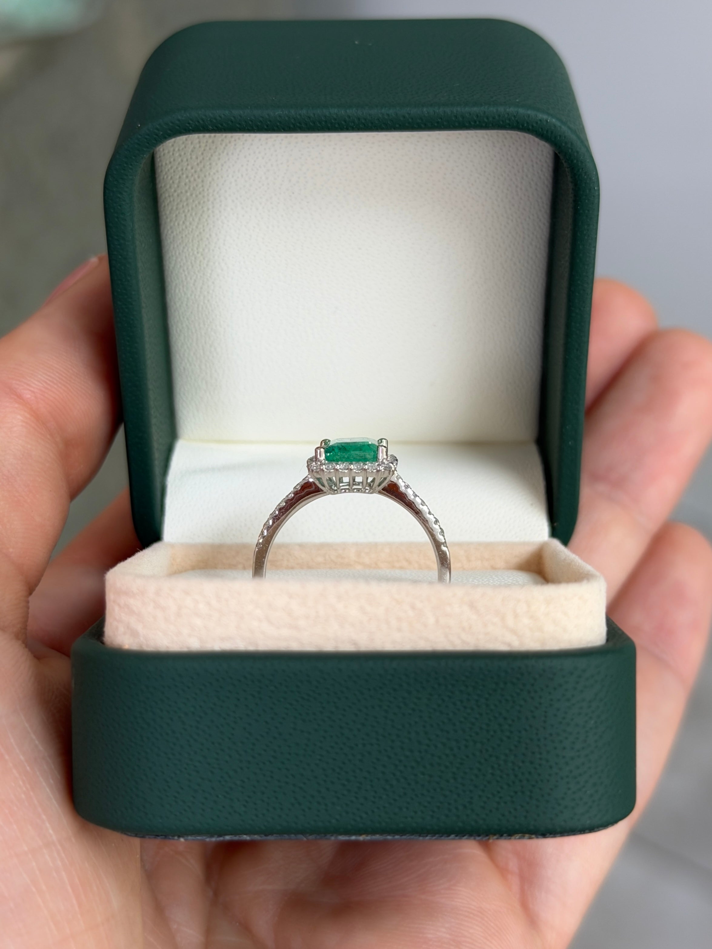 Elegant 14K white gold engagement ring with 1.70tcw Colombian emerald and diamond halo from JR Colombian Emeralds.