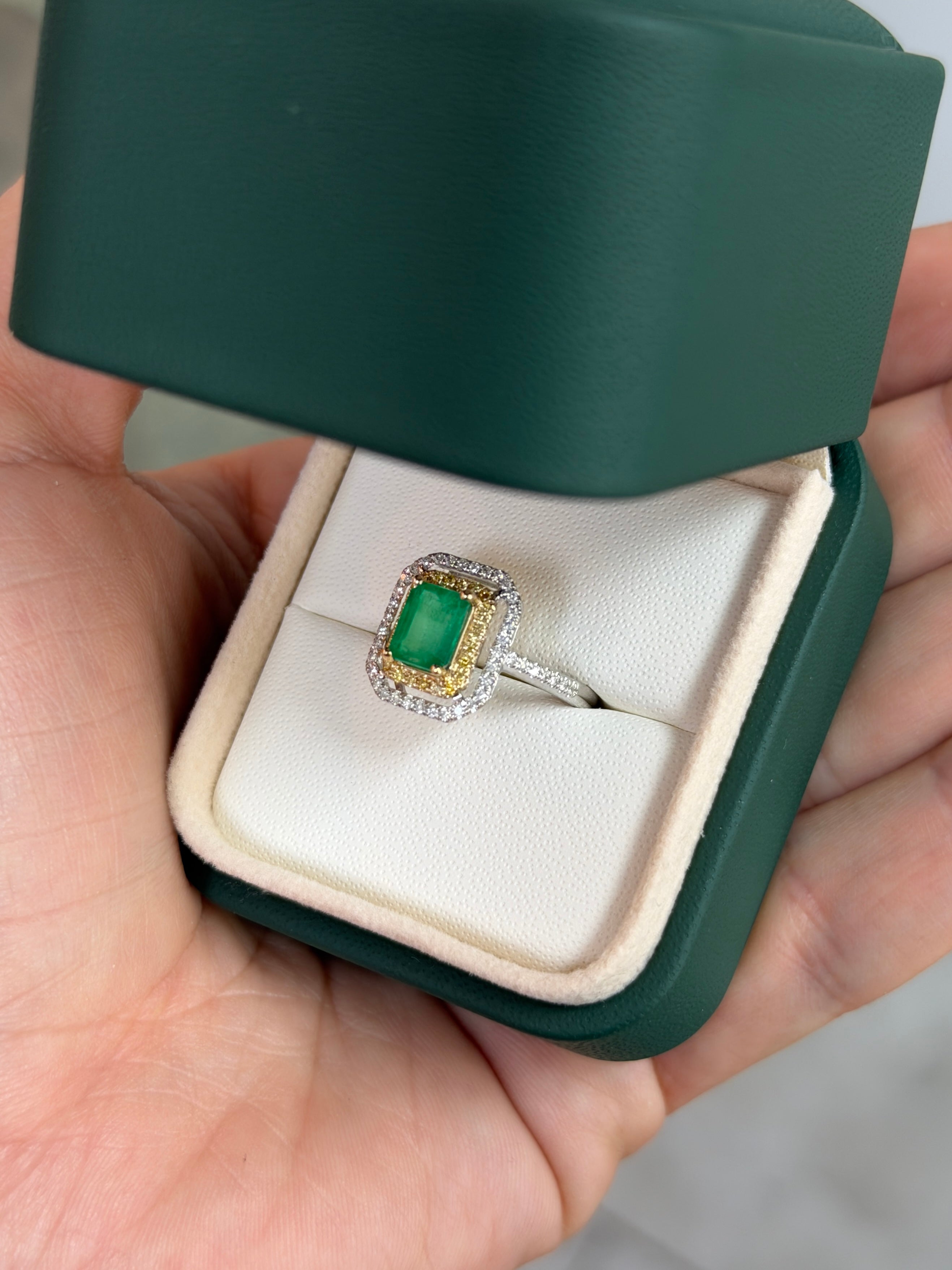 14K gold Colombian emerald and yellow diamond halo ring with detailed setting, showcasing vibrant gemstones and intricate design.