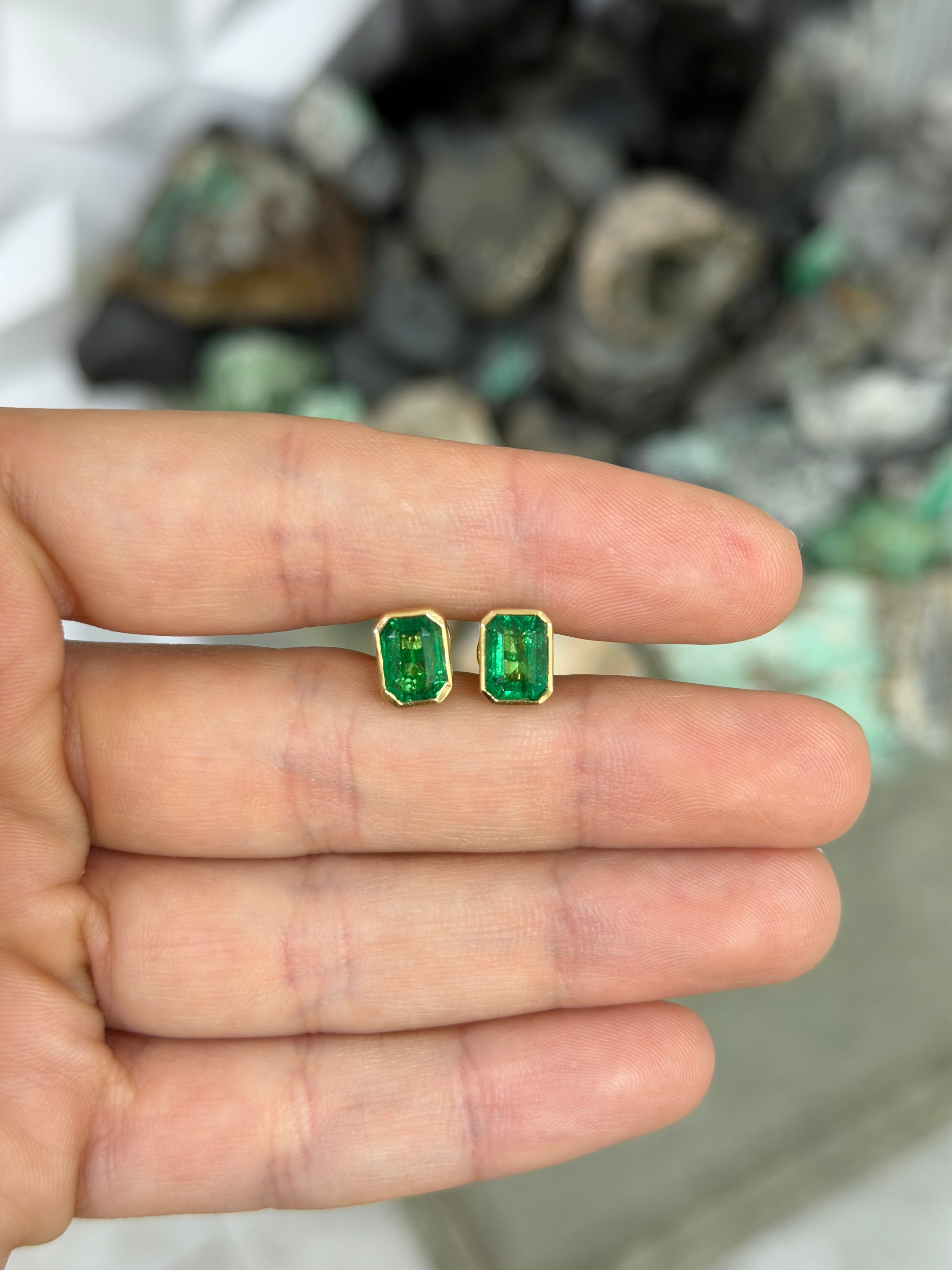 JR Colombian Emeralds 3.33tcw Angelina Jolie bezel set emerald stud earrings in 18K gold, featuring vibrant green gemstones.