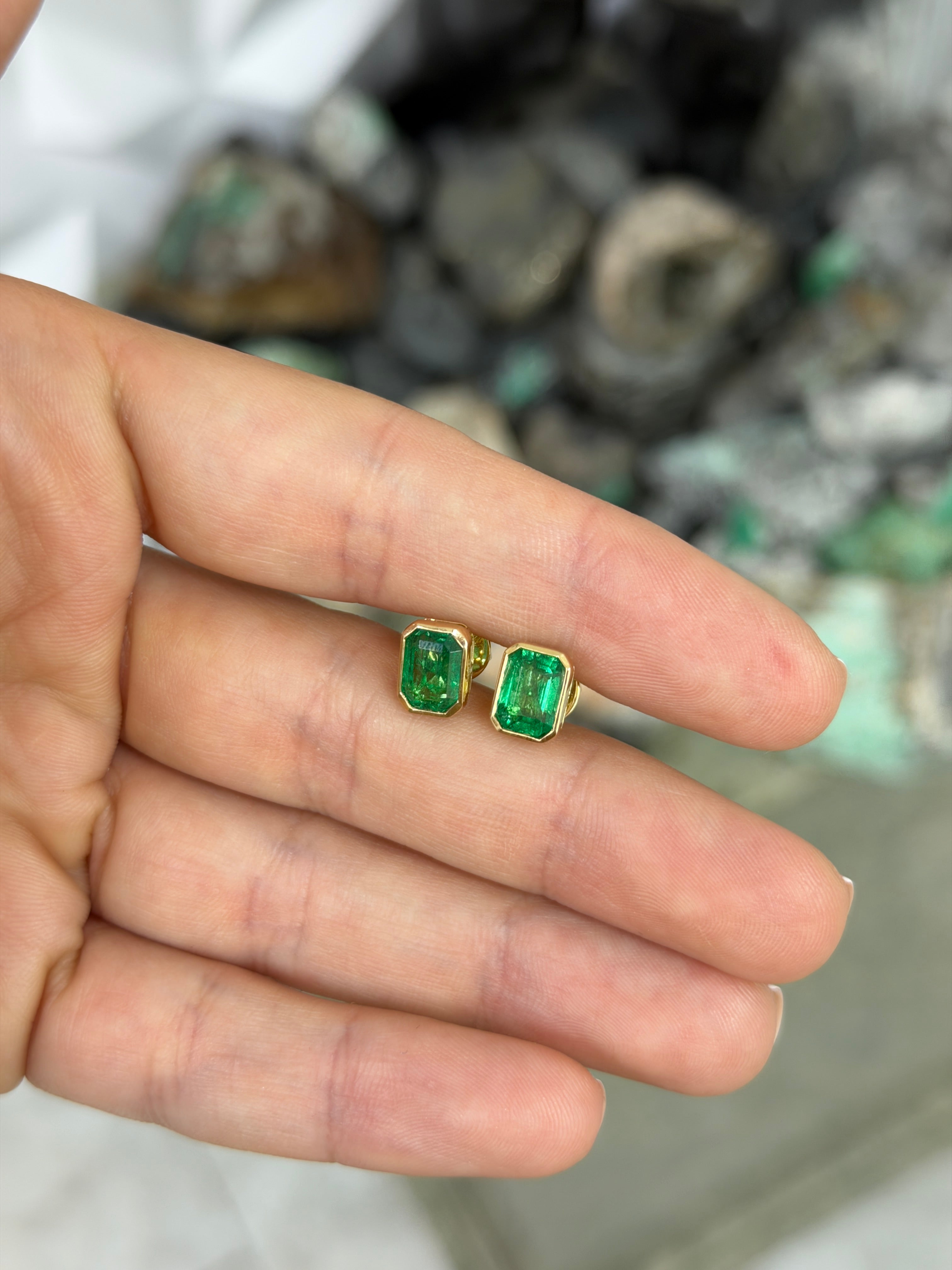 JR Colombian Emeralds 3.33tcw Angelina Jolie bezel set emerald stud earrings in 18K gold, showcasing vibrant green gemstones.