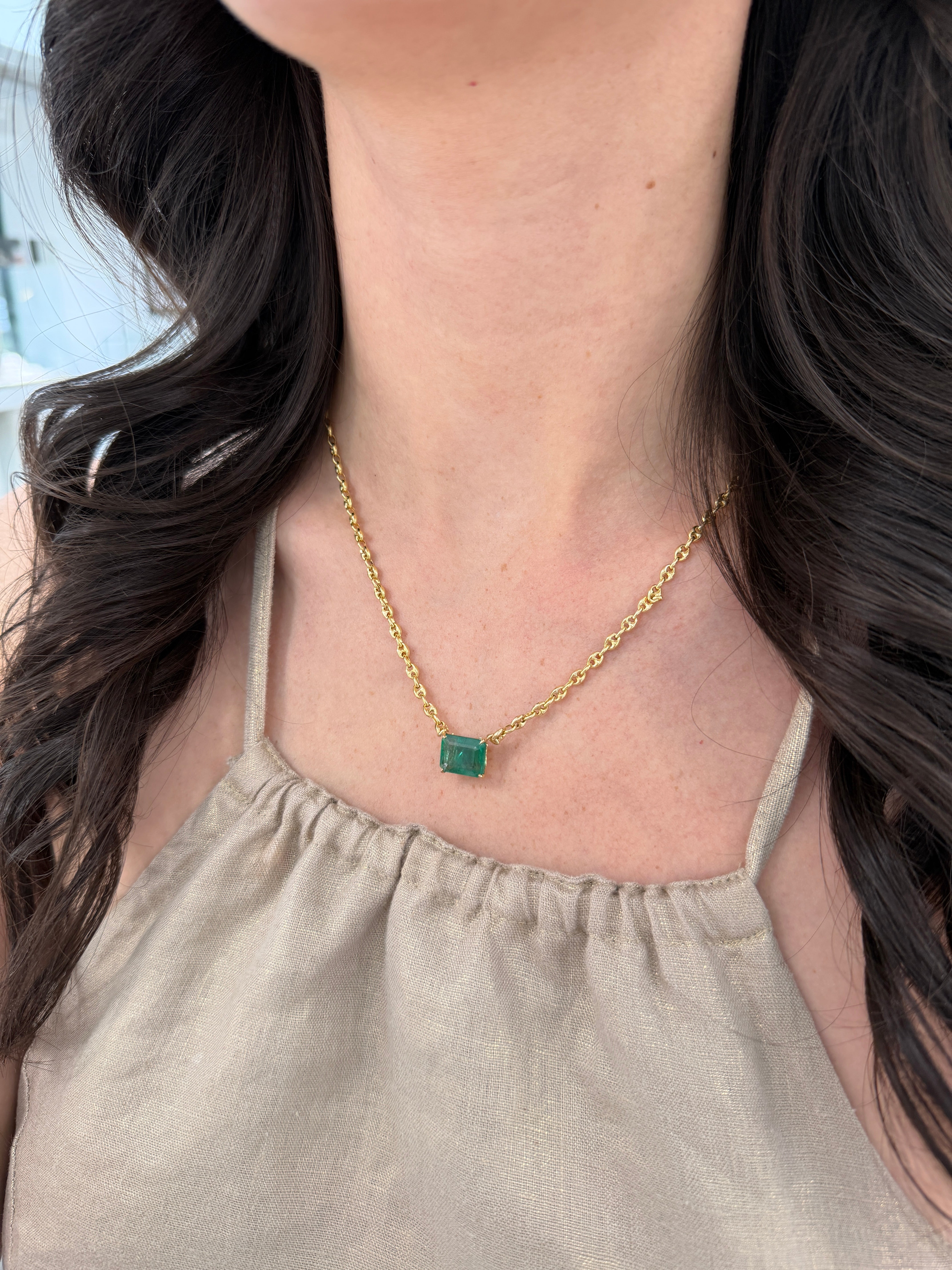 7.30 carat east-to-west emerald solid Gucci link necklace, 20-inch 14K gold, featuring vibrant green Colombian emeralds.