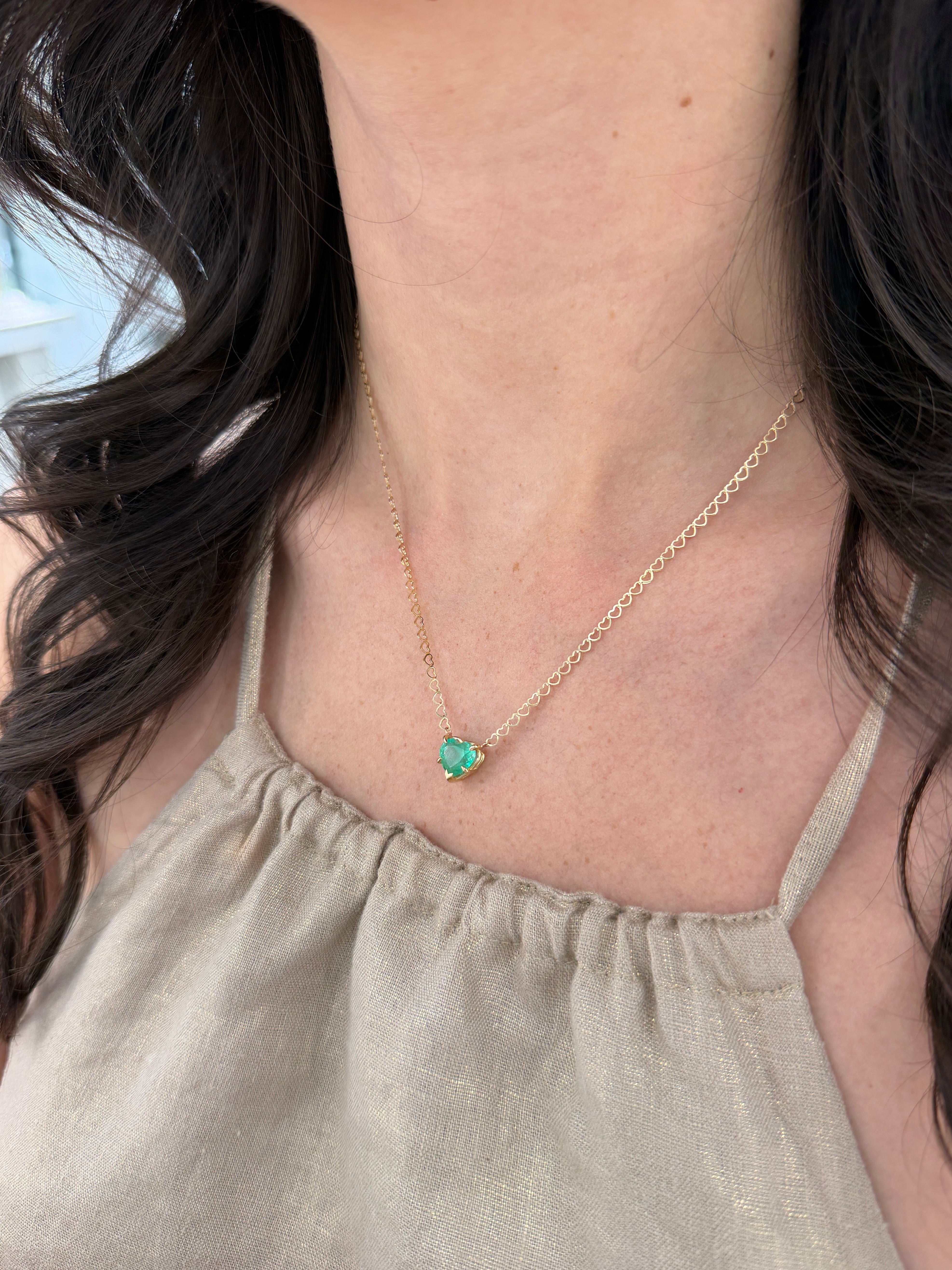 Natural Colombian emerald heart solitaire necklace in 14K gold with a 2.70 carat emerald, showcasing elegant jewelry design.
