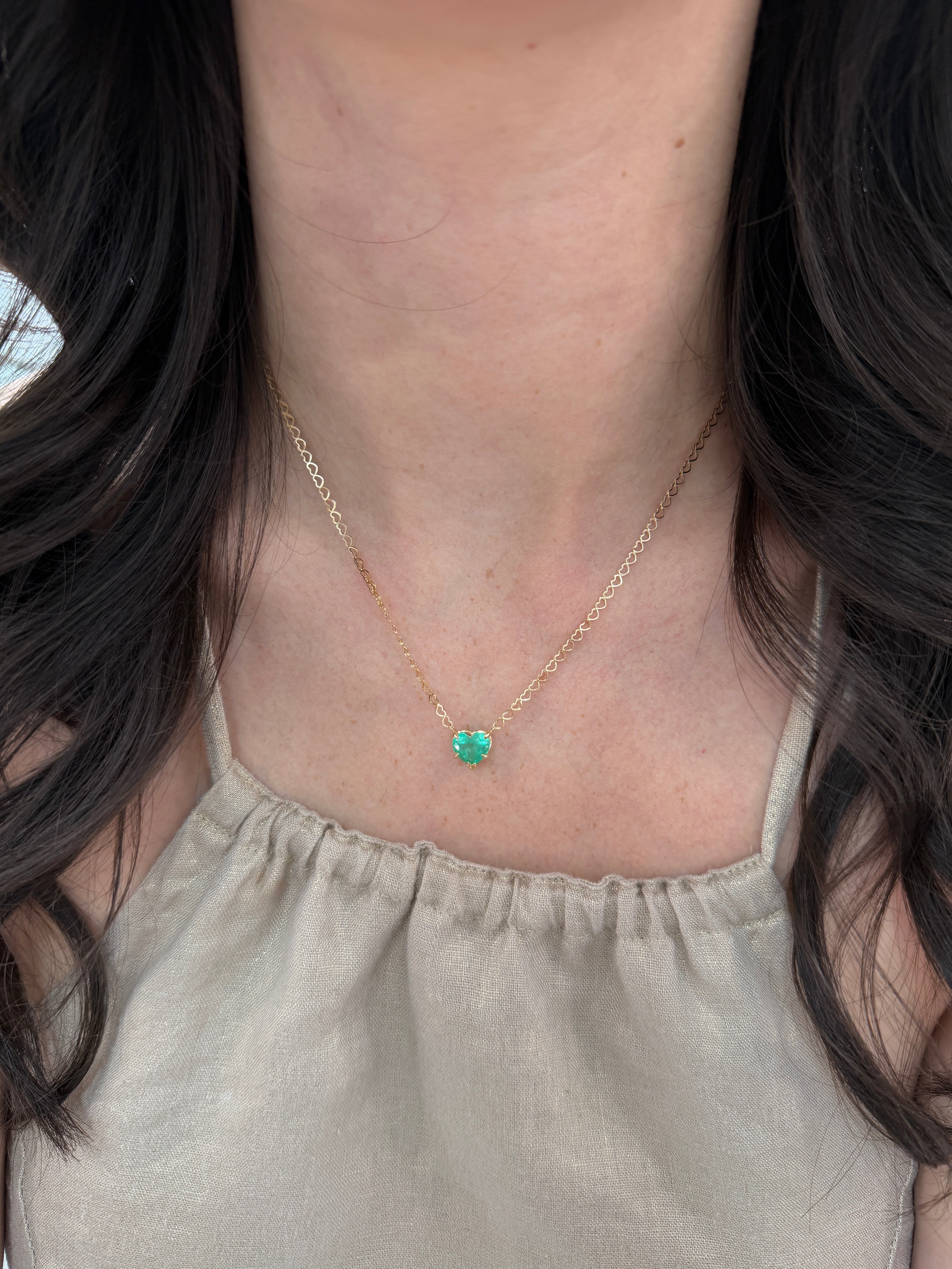 Natural Colombian emerald heart pendant necklace featuring a 2.70-carat emerald on a 14K chain, by JR Colombian Emeralds.