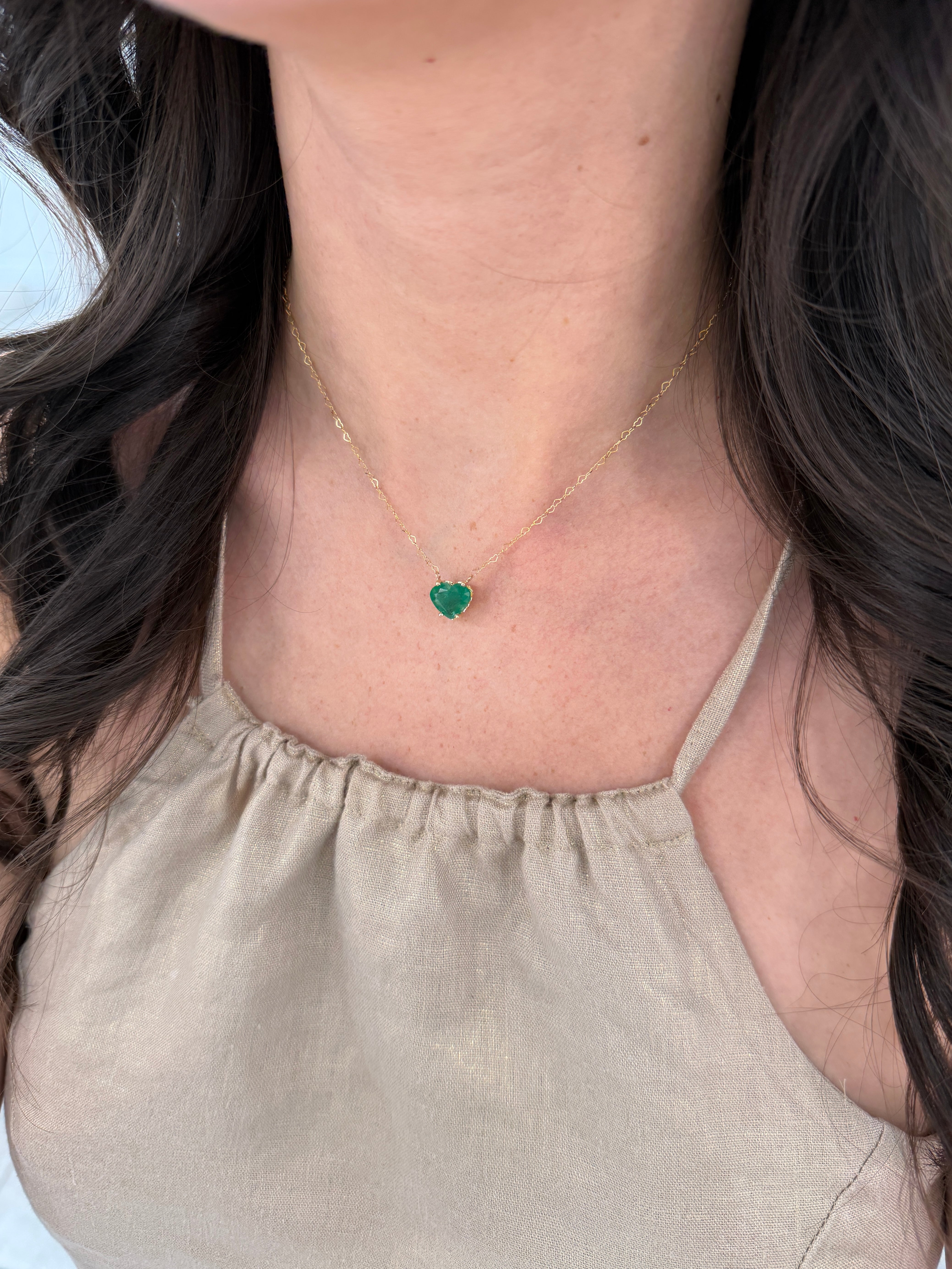 Natural Zambian emerald heart solitaire necklace featuring a 4.07-carat emerald pendant on a delicate chain, by JR Colombian Emeralds.