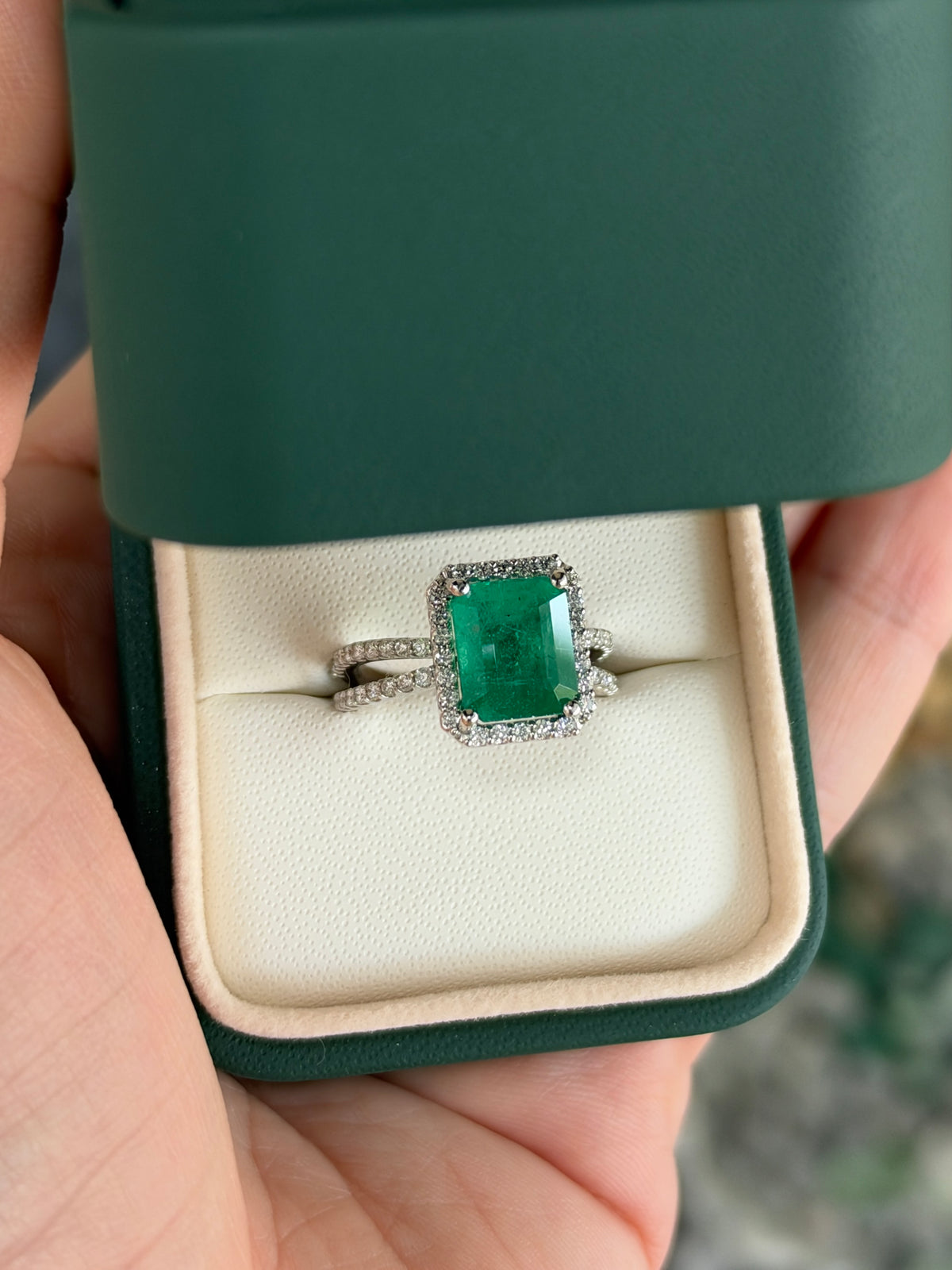 14K white gold engagement ring with 4.37tcw emerald cut emerald center and diamond halo, split shank design by JR Colombian Emeralds
