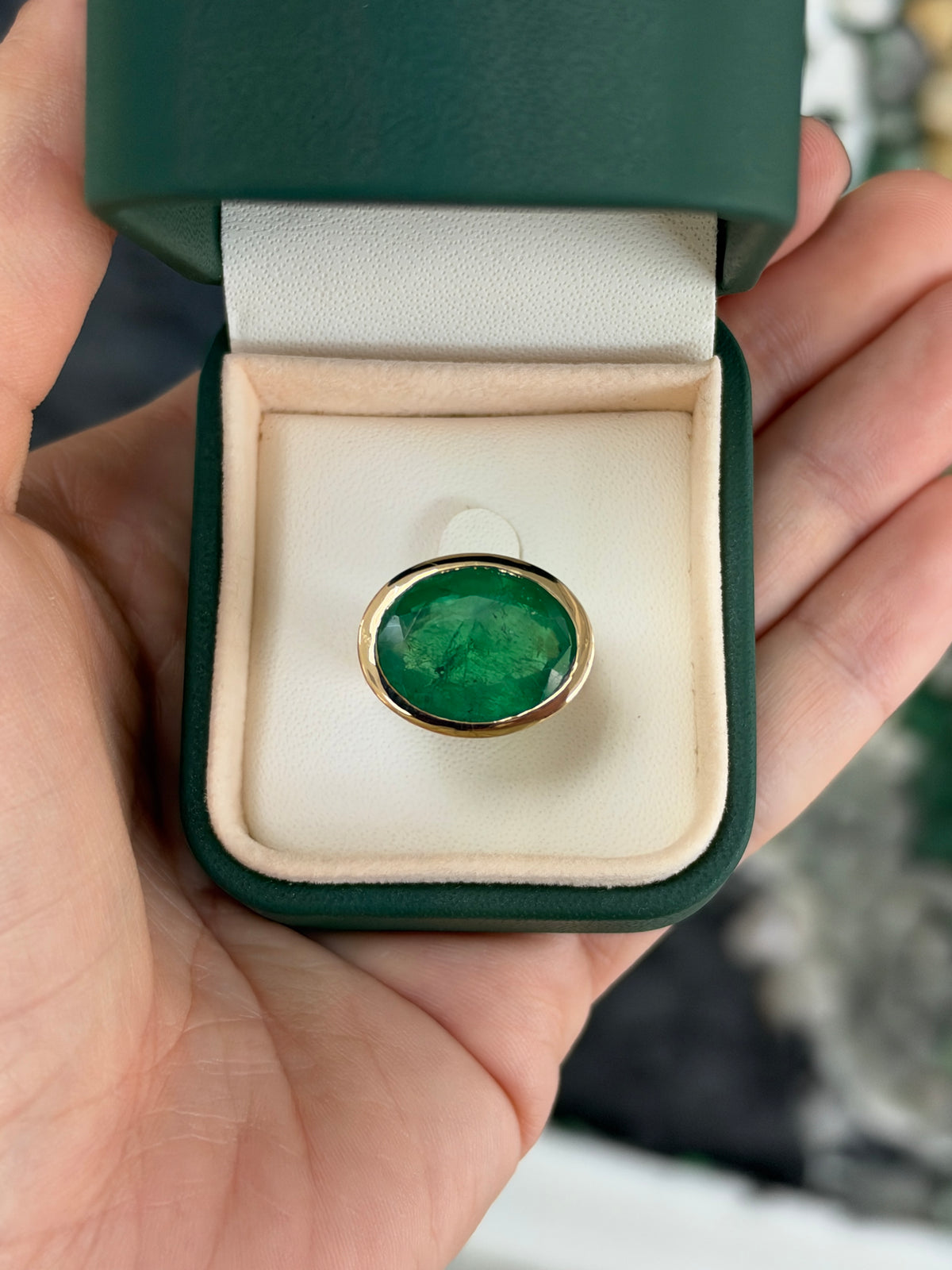 12.61ct 18K East to West Oval Emerald Bezel 5.7mm Wide Band Ring