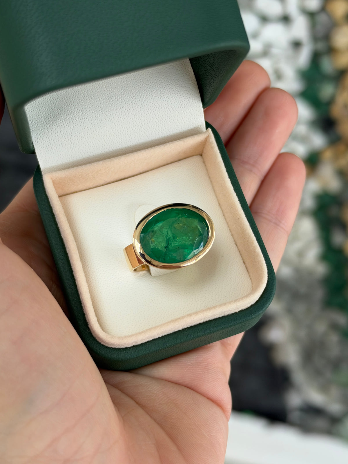 12.61ct 18K East to West Oval Emerald Bezel 5.7mm Wide Band Ring