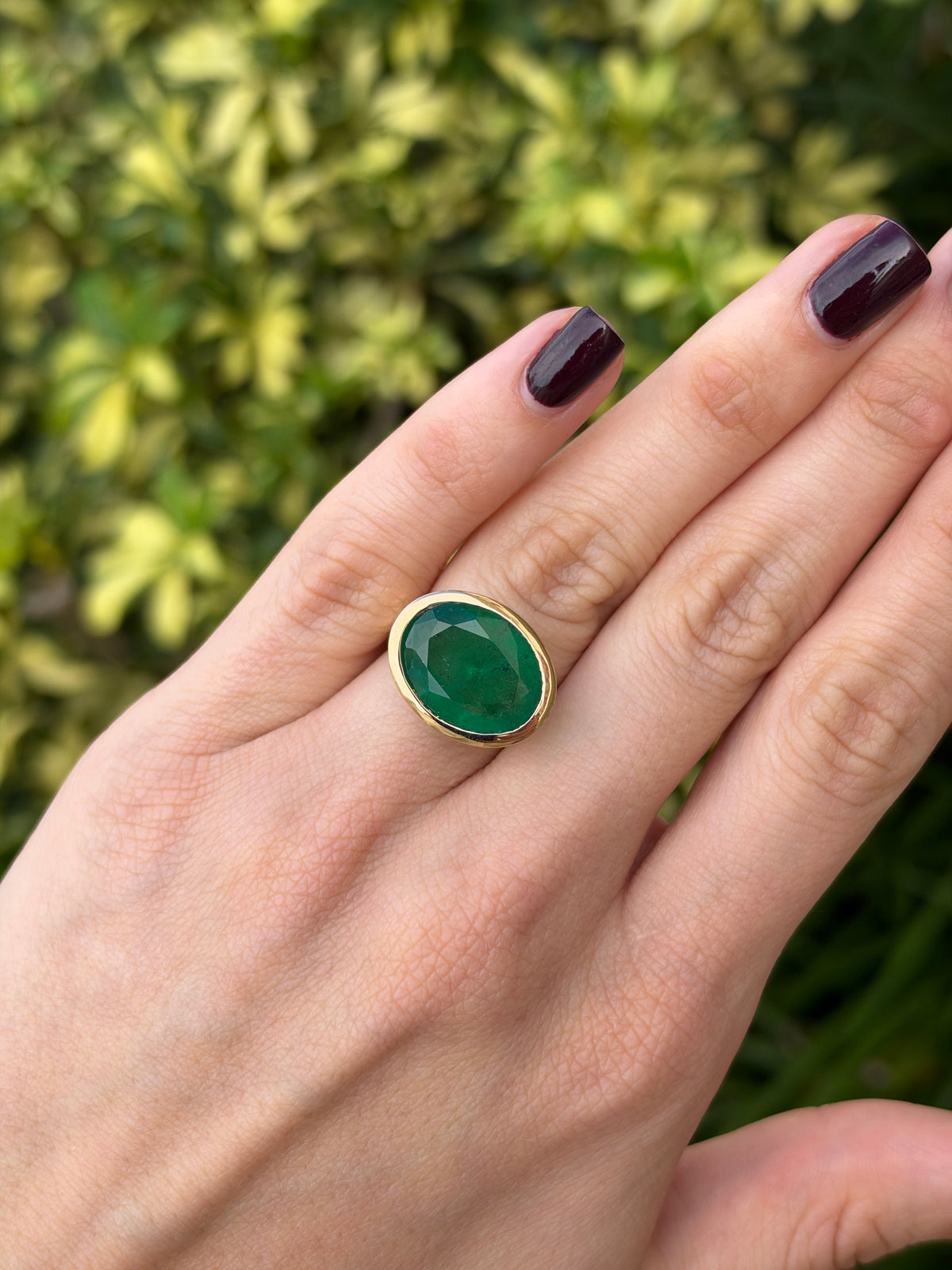 12.61ct 18K East to West Oval Emerald Bezel 5.7mm Wide Band Ring