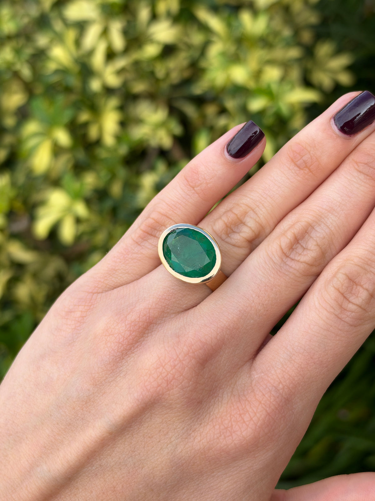 12.61ct 18K East to West Oval Emerald Bezel 5.7mm Wide Band Ring