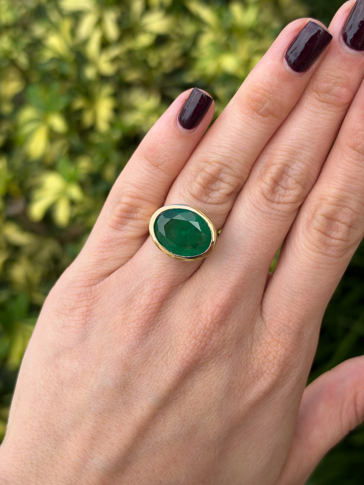 12.61ct 18K East to West Oval Emerald Bezel 5.7mm Wide Band Ring